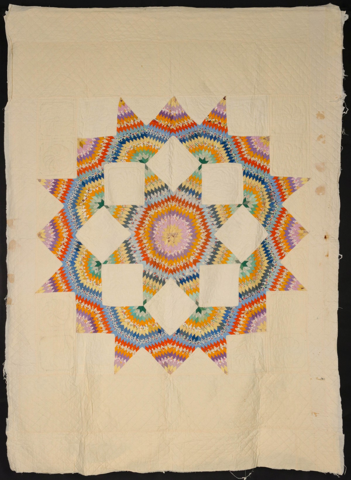 A LONE STAR QUILT IN FEEDSACK FABRICS