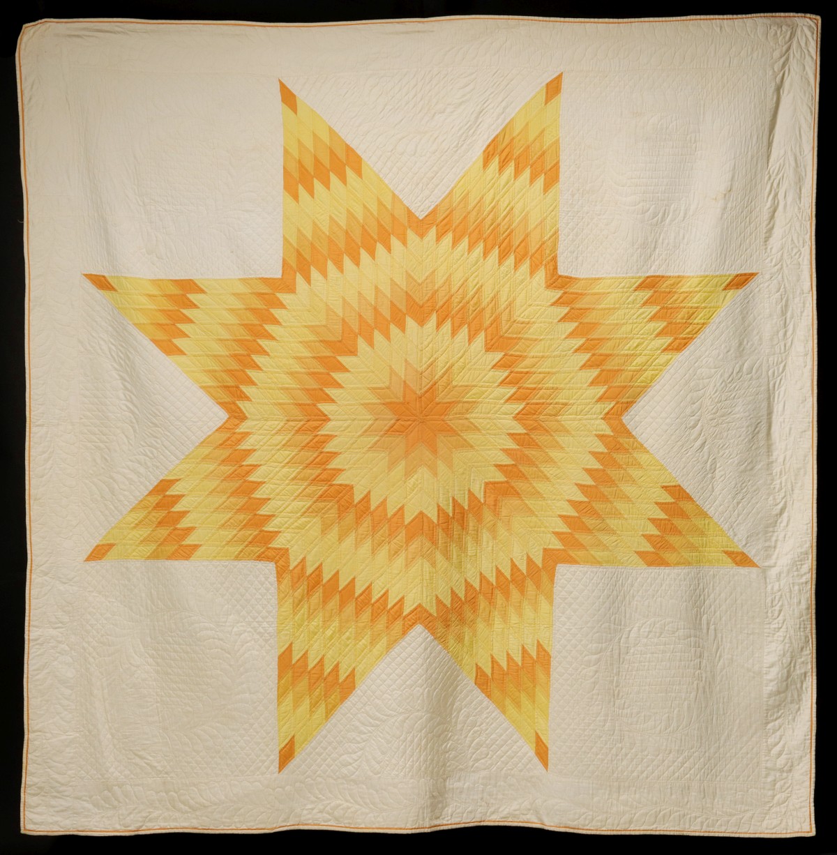 A VINTAGE HAND STITCHED LONE STAR PATTERN QUILT