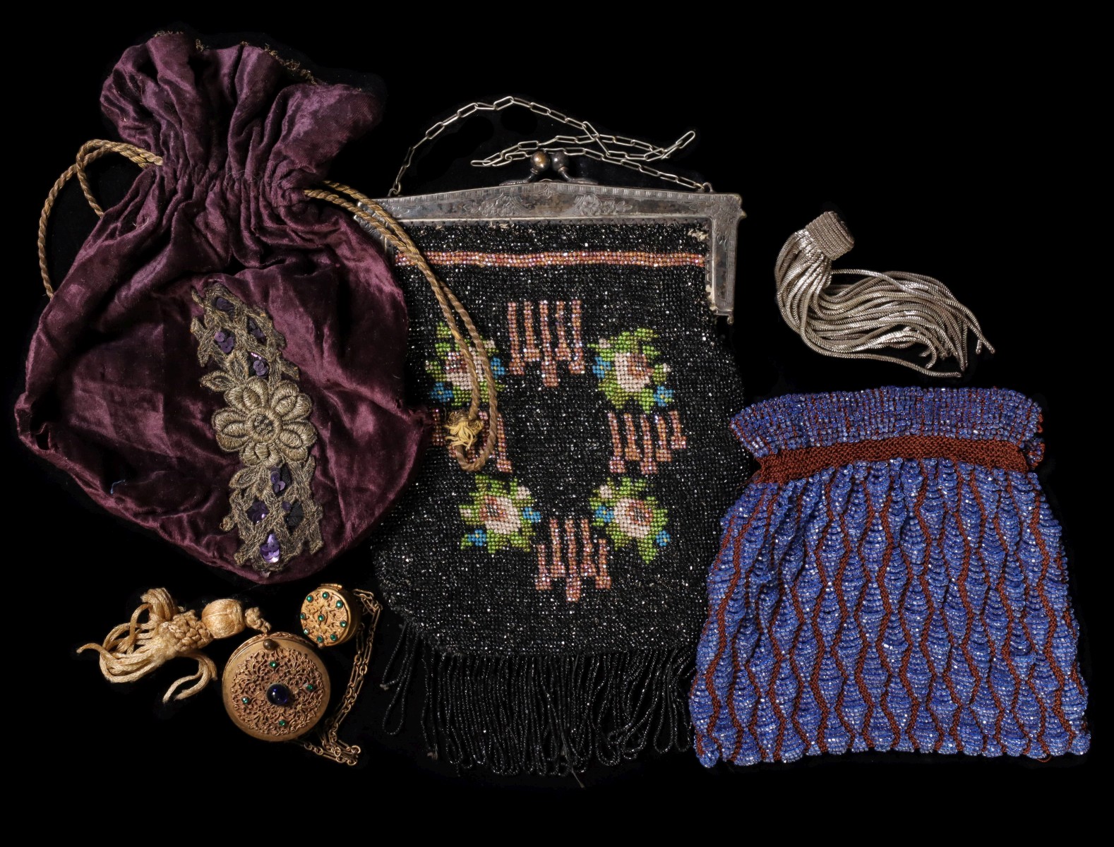 A COLLECTION OF ANTIQUE BEADED AND EMBROIDERED PURSES