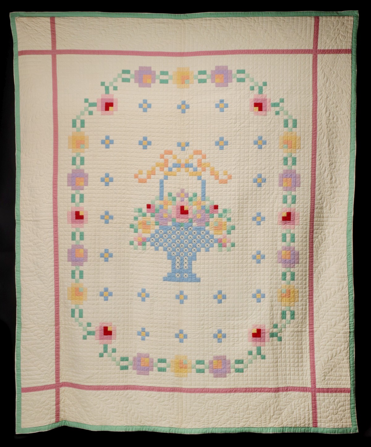 A 1930s PIECED AND FINELY STITCHED FLOWER BASKET QUILT