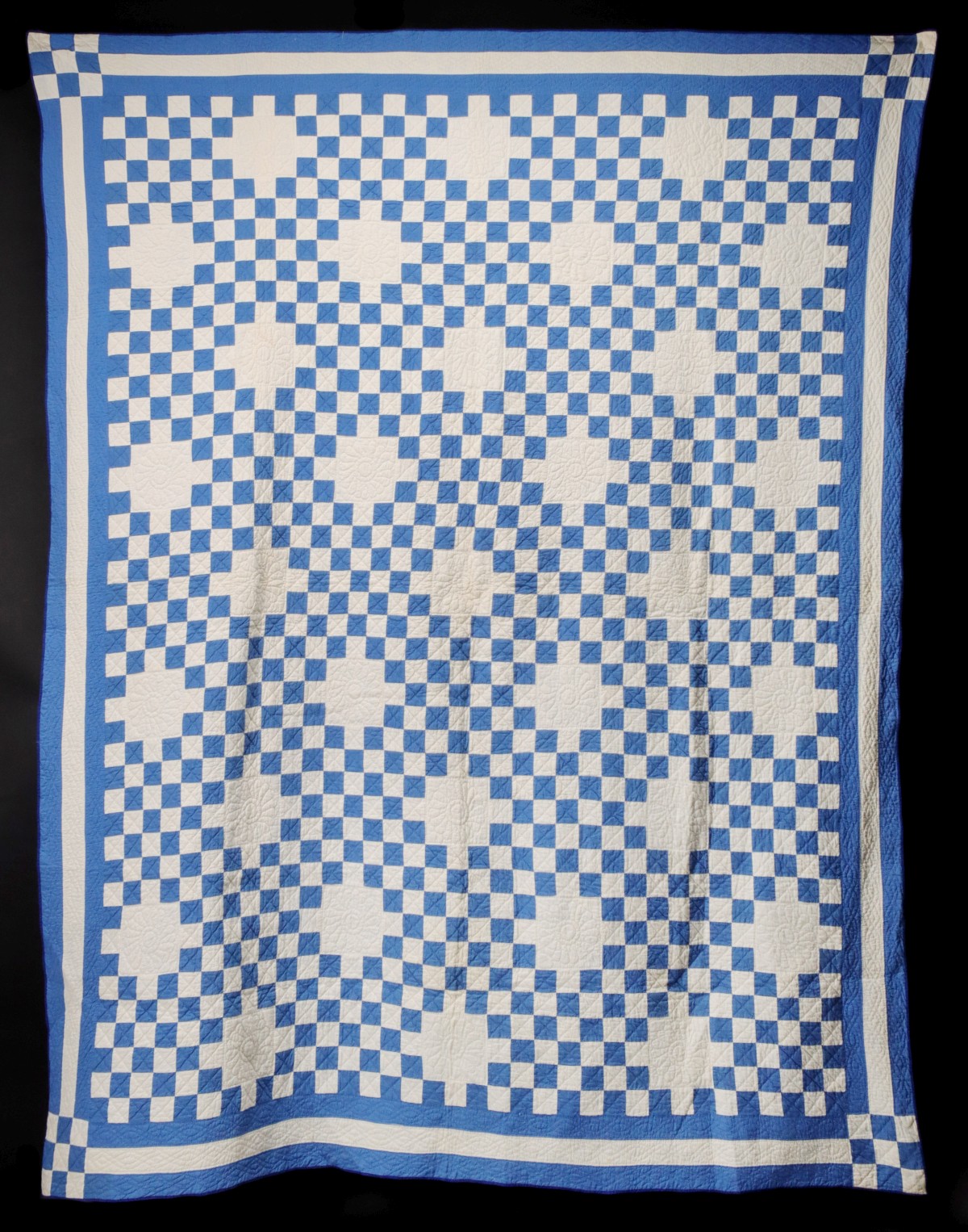 A BLUE AND WHITE TRIPLE IRISH CHAIN QUILT