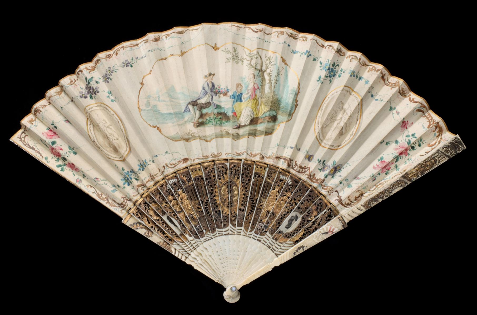 AN ELABORATE 19C. HAND FAN WITH SILVER OVERLAID STICKS