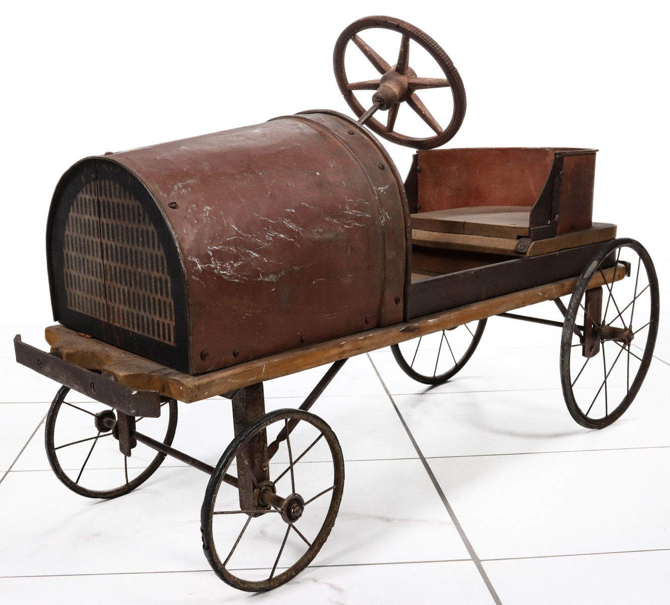 A CIRCA 1900 STEEL AND WOOD COASTER 'PEDAL CAR'