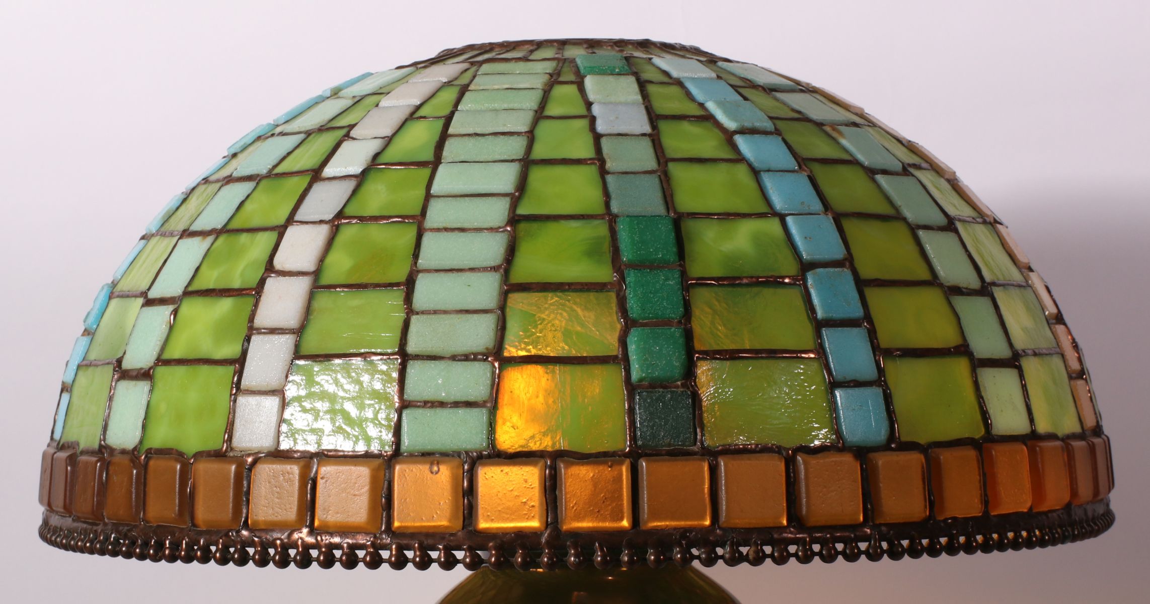 A CONTEMPORARY HAND MADE STAINED AND LEADED GLASS SHADE