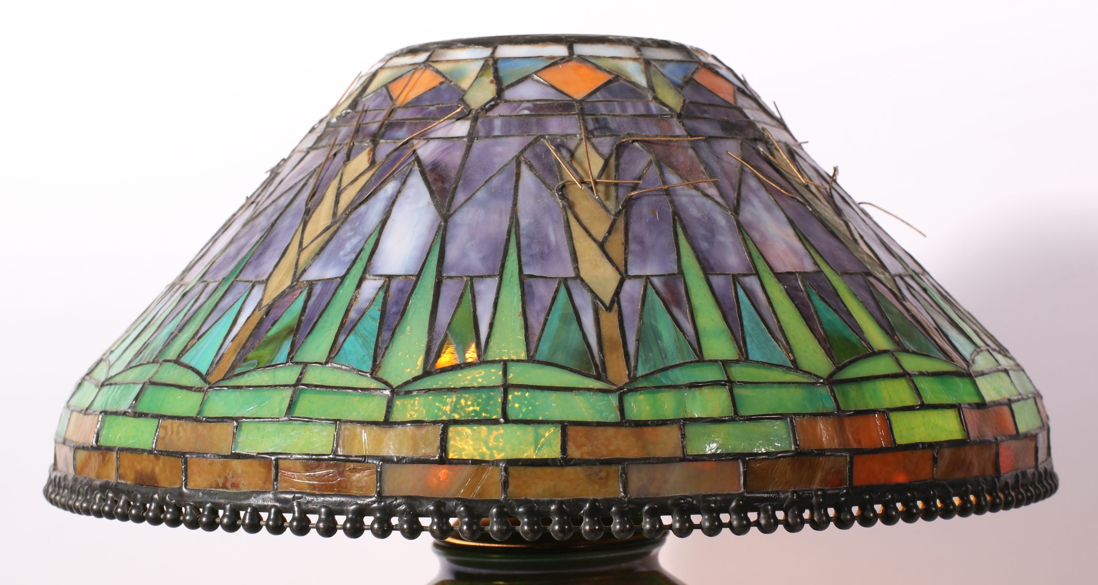 A CONTEMPORARY HAND MADE STAINED AND LEADED GLASS SHADE