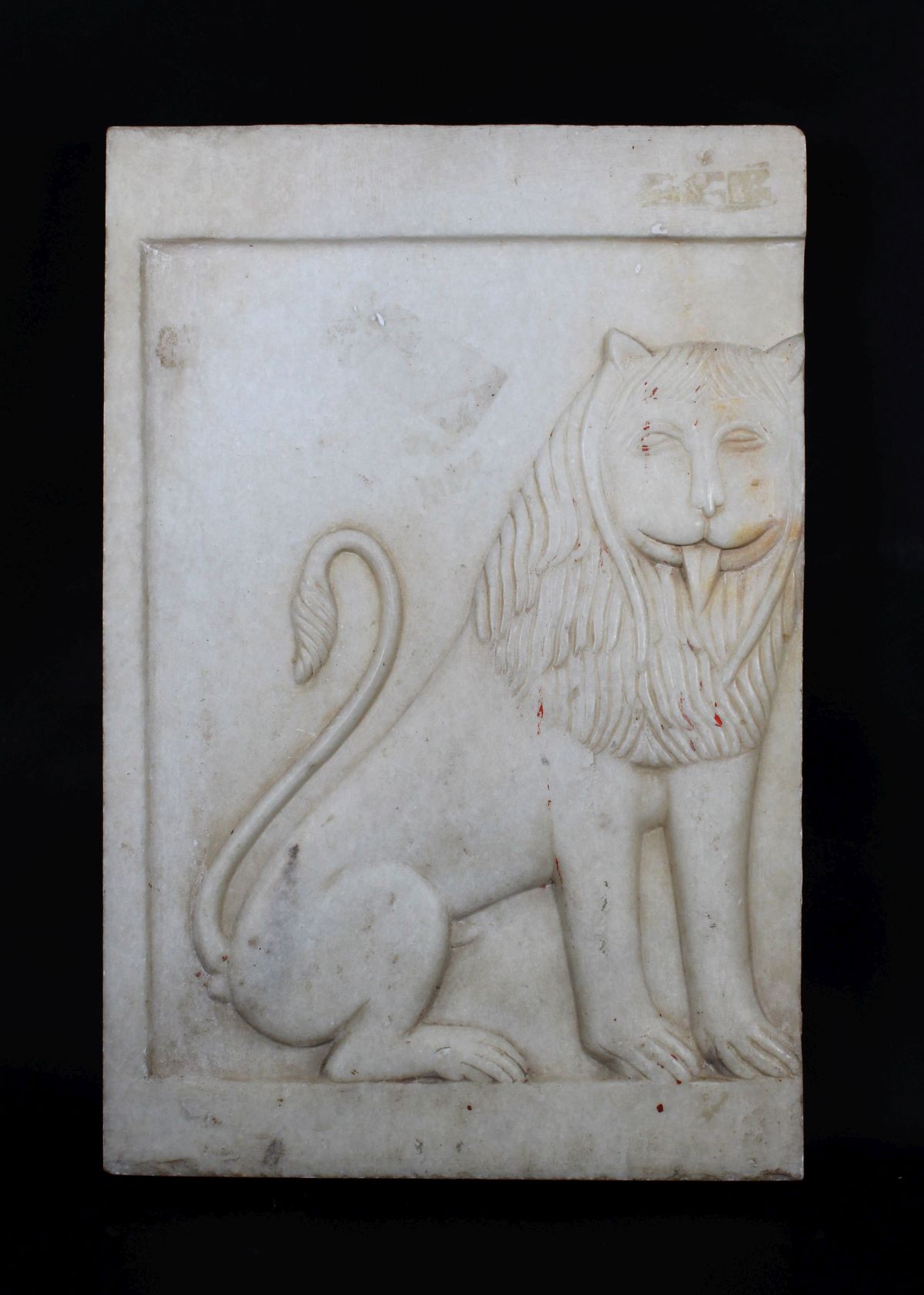 A CARVED MARBLE LION ARCHITECTURAL FRIEZE FRAGMENT