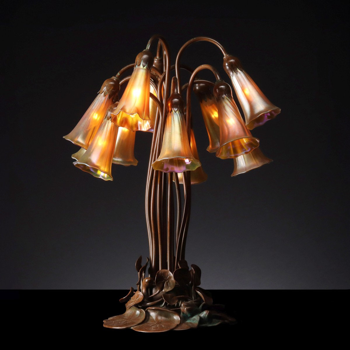 A BUFFALO METALWORKS 12-LIGHT BRONZE NOUVEAU LILY LAMP