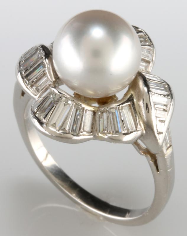 A PLATINUM PEARL AND DIAMOND FASHION RING