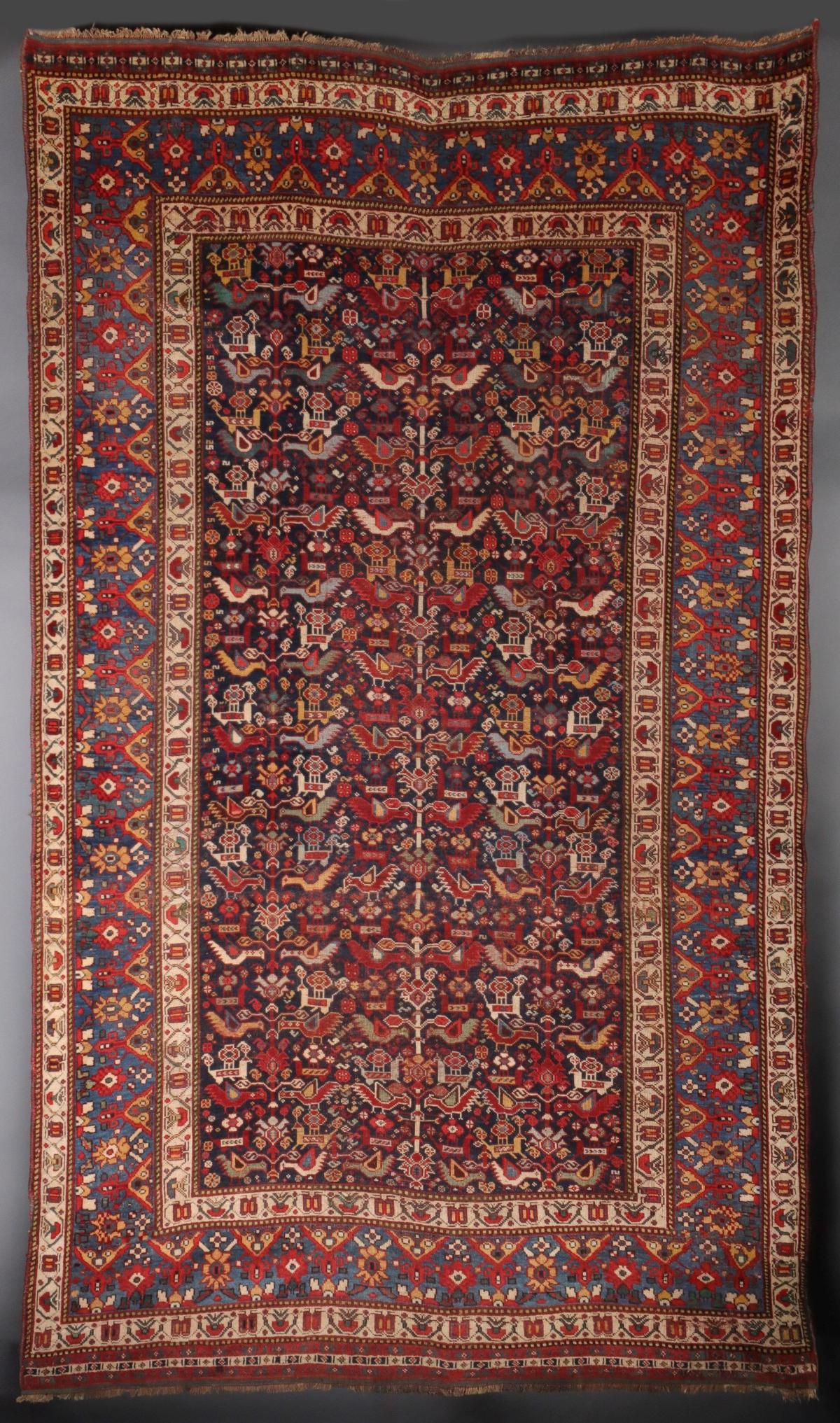 A SOUTHWEST PERSIAN KAMSEH AREA RUG CIRCA 1900