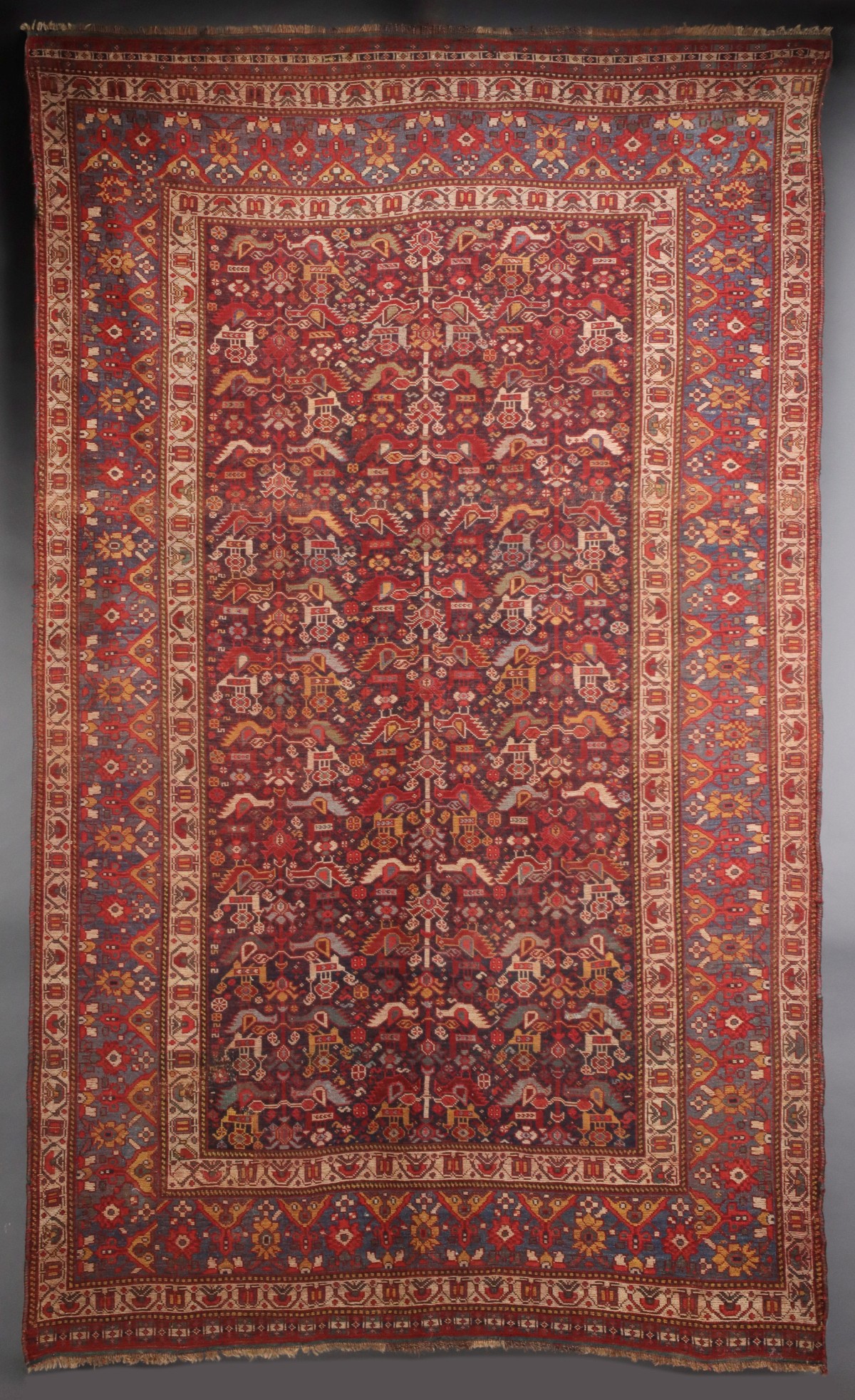 A SOUTHWEST PERSIAN KAMSEH AREA RUG CIRCA 1900