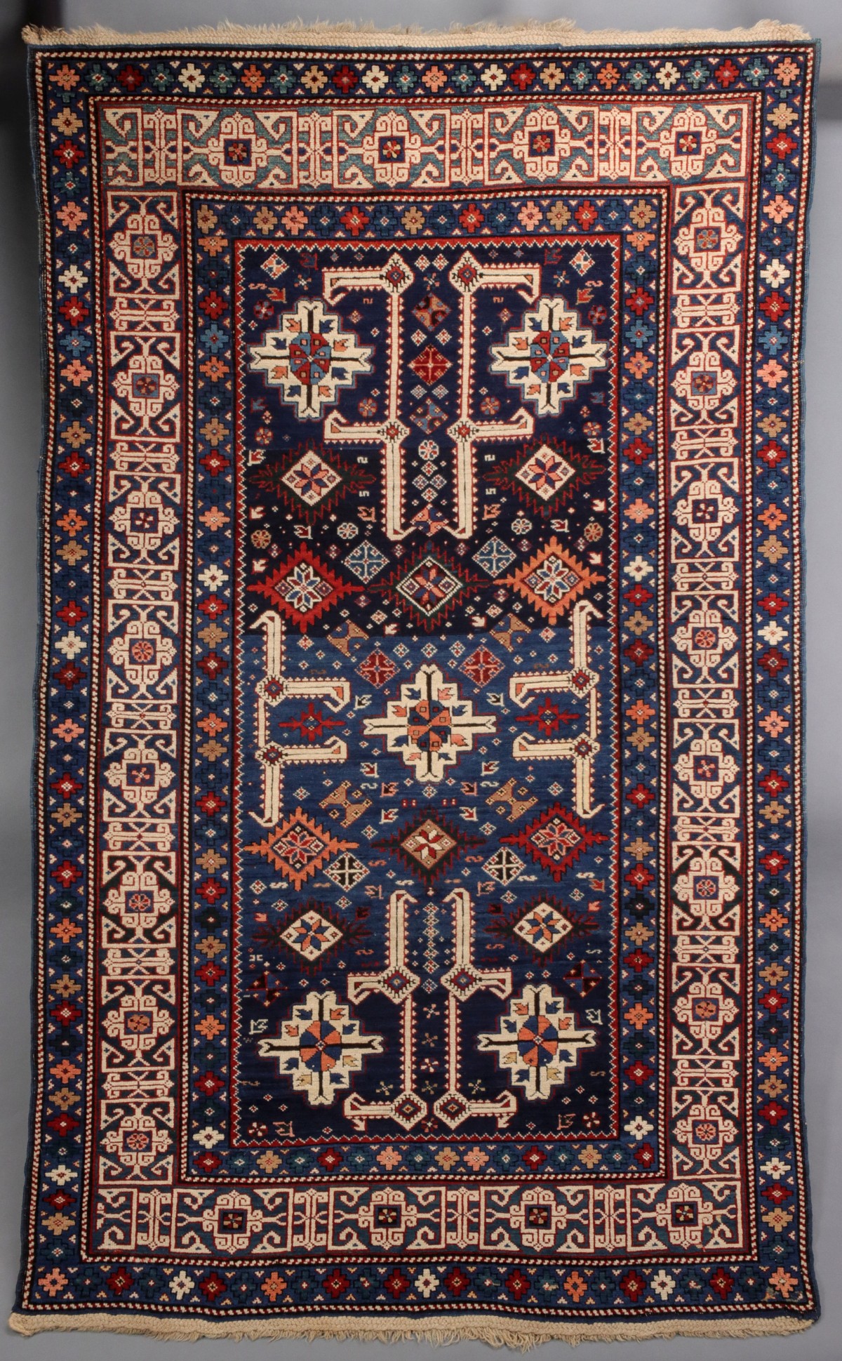 AN ANTIQUE KUBA CAUCASIAN SCATTER RUG CIRCA 1890