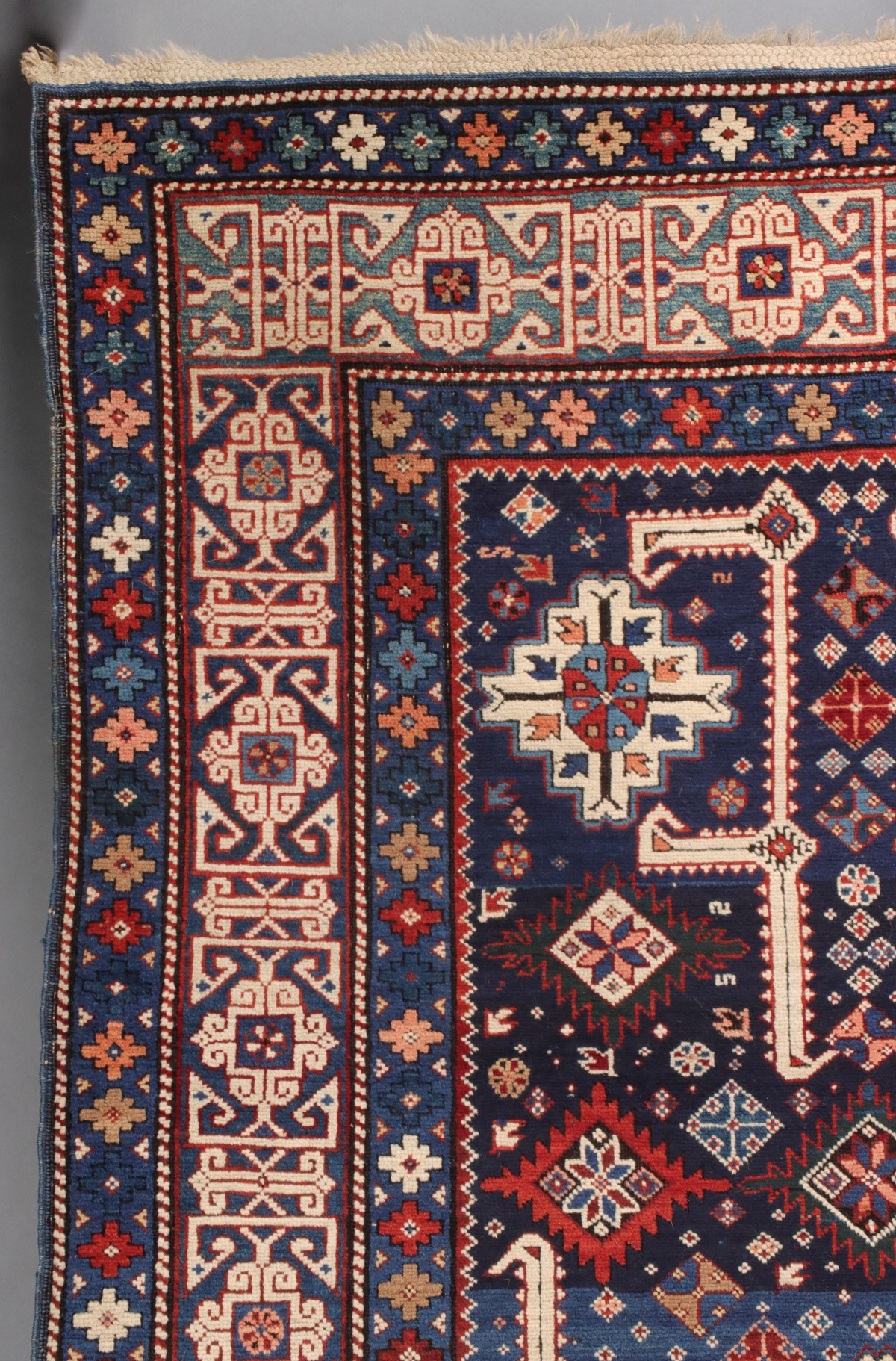 AN ANTIQUE KUBA CAUCASIAN SCATTER RUG CIRCA 1890