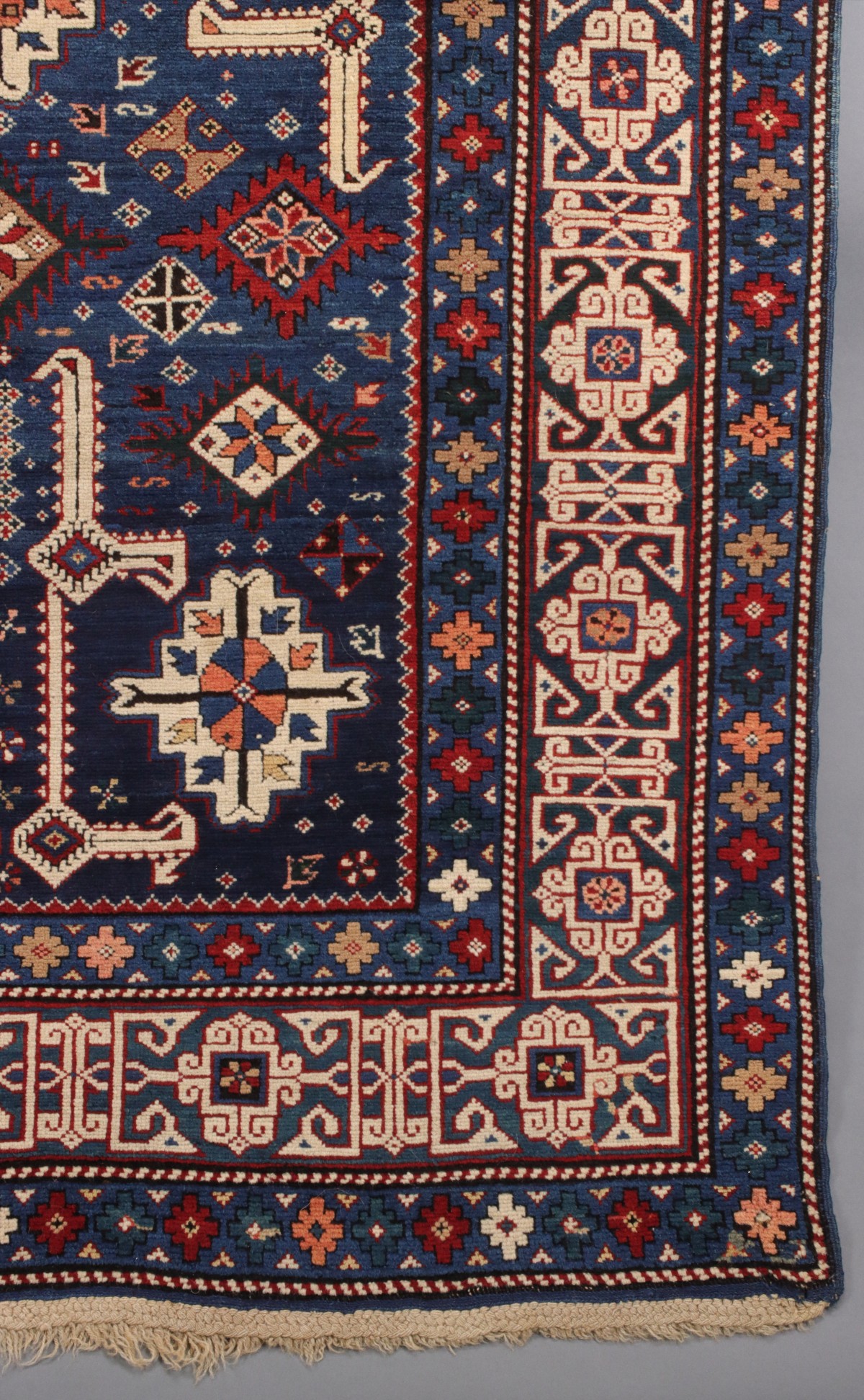 AN ANTIQUE KUBA CAUCASIAN SCATTER RUG CIRCA 1890