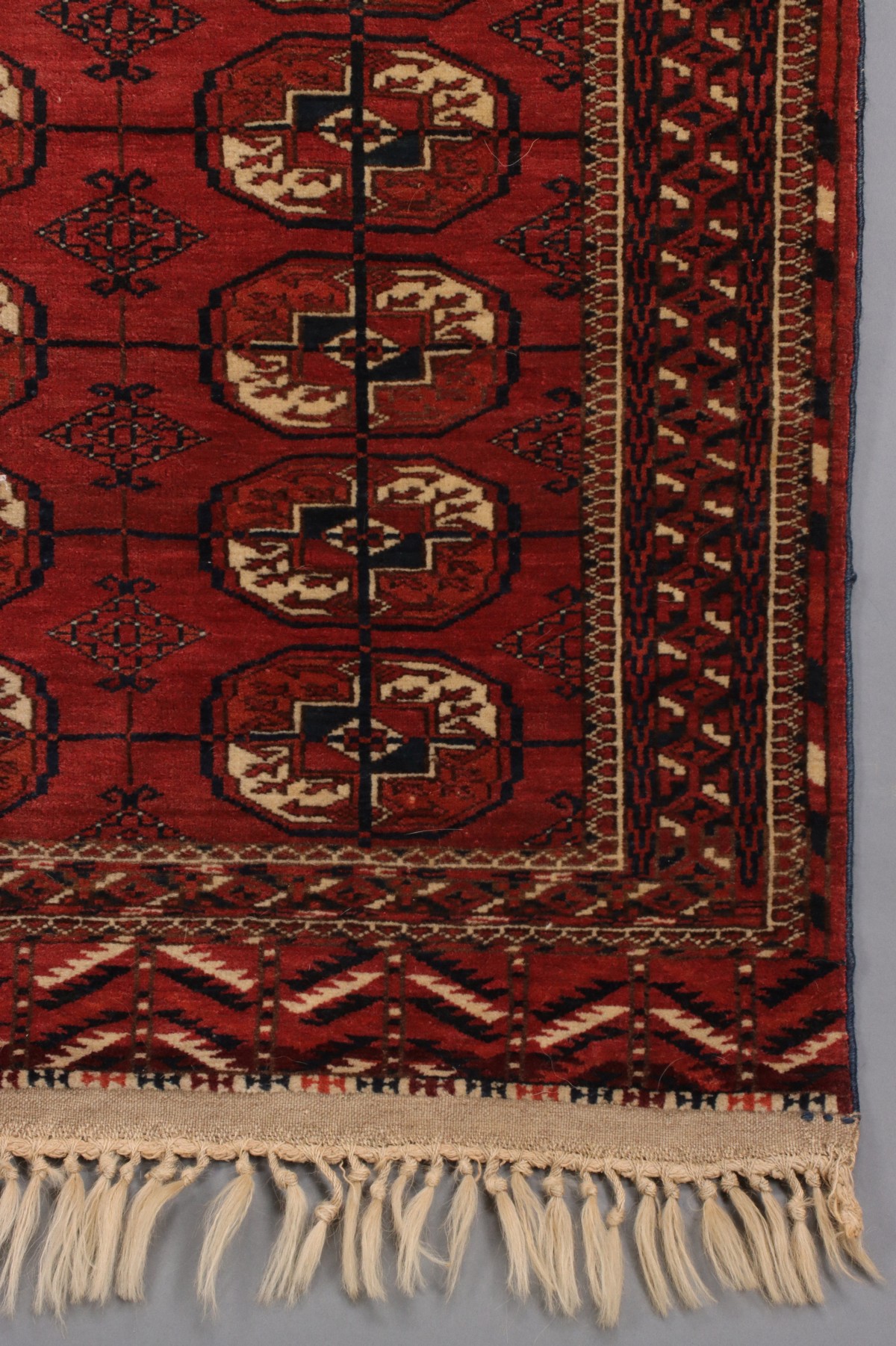 A WEST TURKESTAN TEKKE SCATTER RUG CIRCA 1910