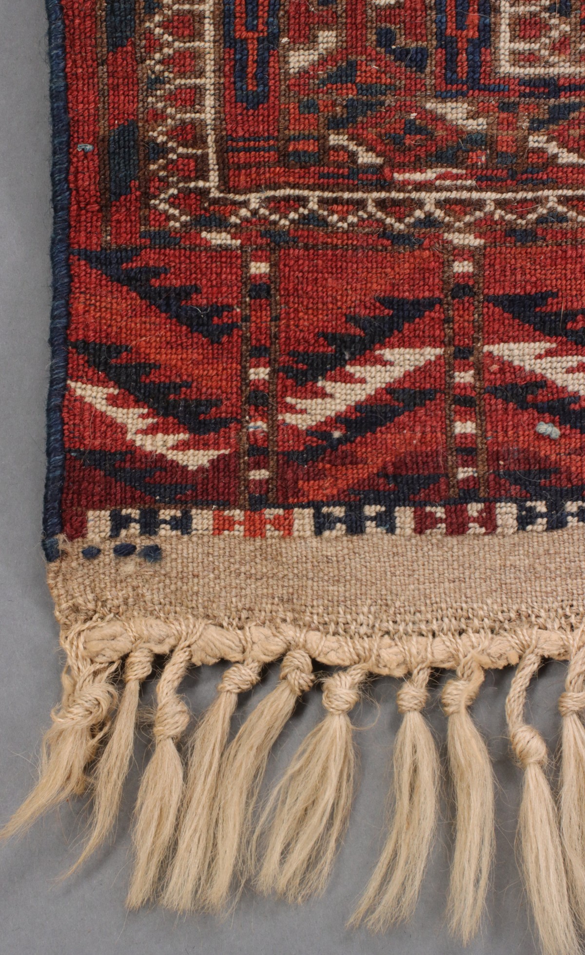 A WEST TURKESTAN TEKKE SCATTER RUG CIRCA 1910