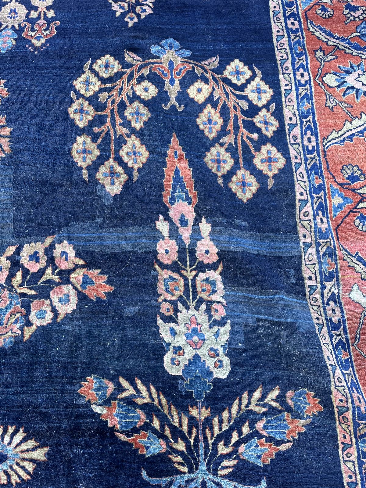 A SPACIOUS JEWEL TONE SAROUK CARPET CIRCA 1910