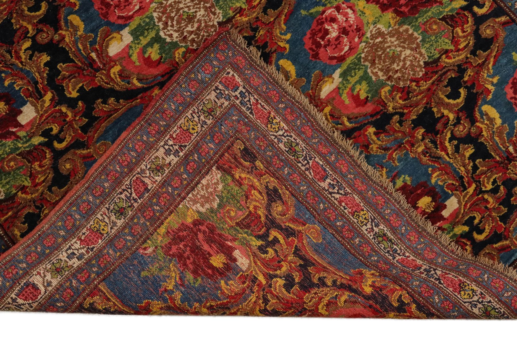 A PERSIAN BIJAR CARPET WITH FLORAL SPRAYS CIRCA 1900