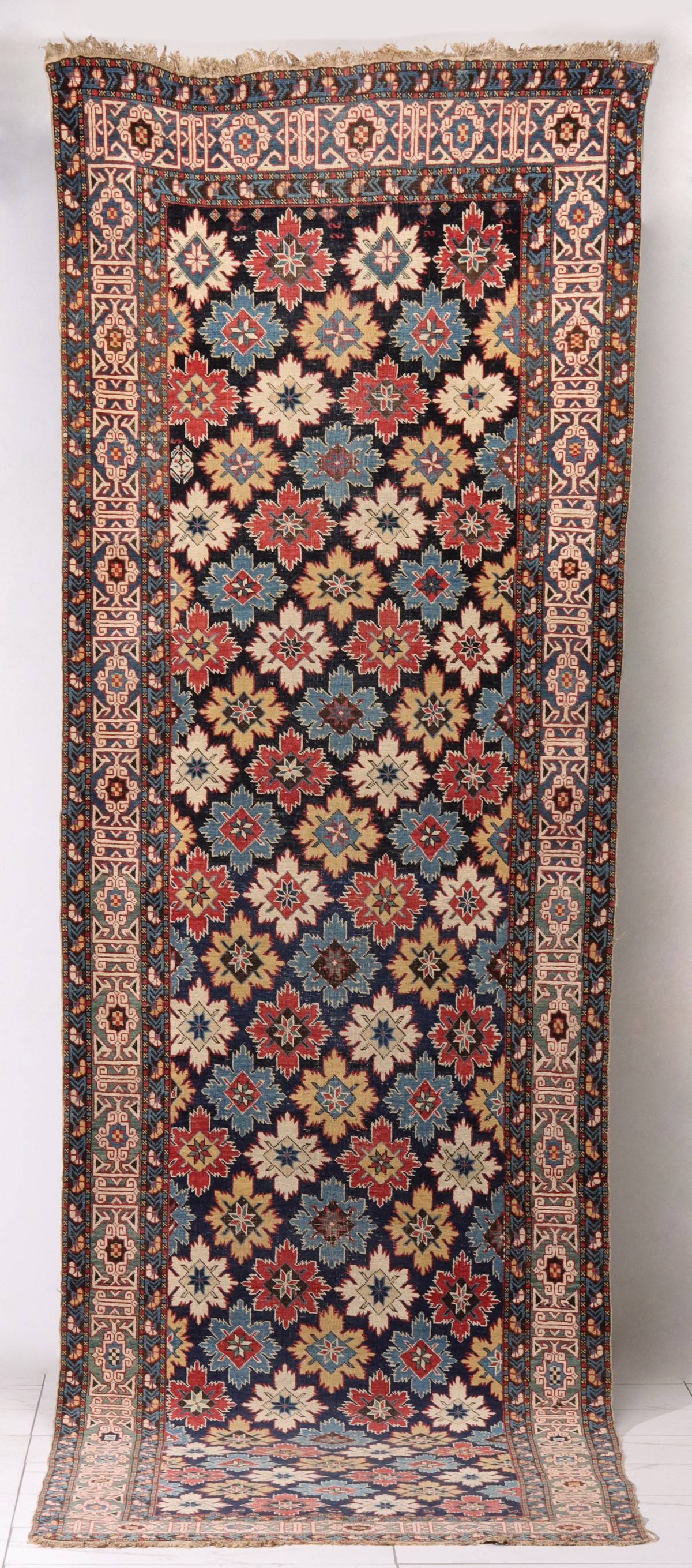 A FINE ANTIQUE NORTHEAST CAUCASUS KUBA RUNNER RUG