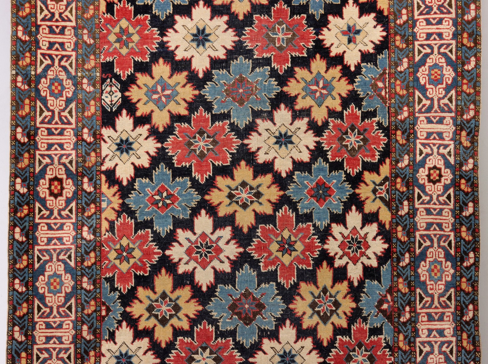 A FINE ANTIQUE NORTHEAST CAUCASUS KUBA RUNNER RUG