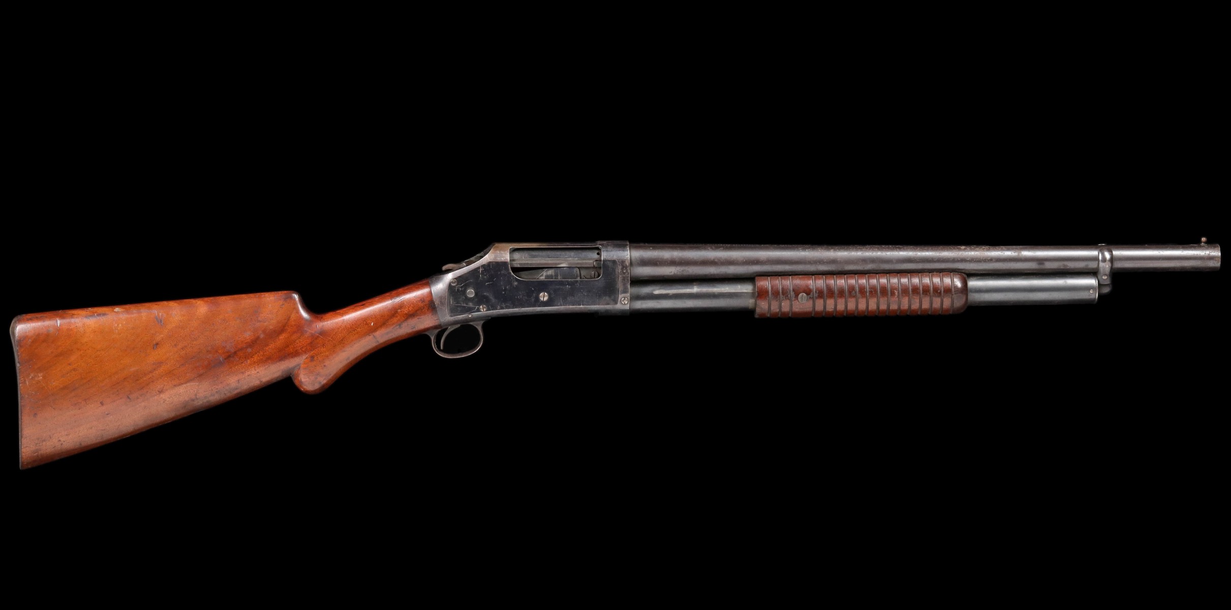 A WINCHESTER 12 GAUGE MODEL 1897 RIOT SHOTGUN