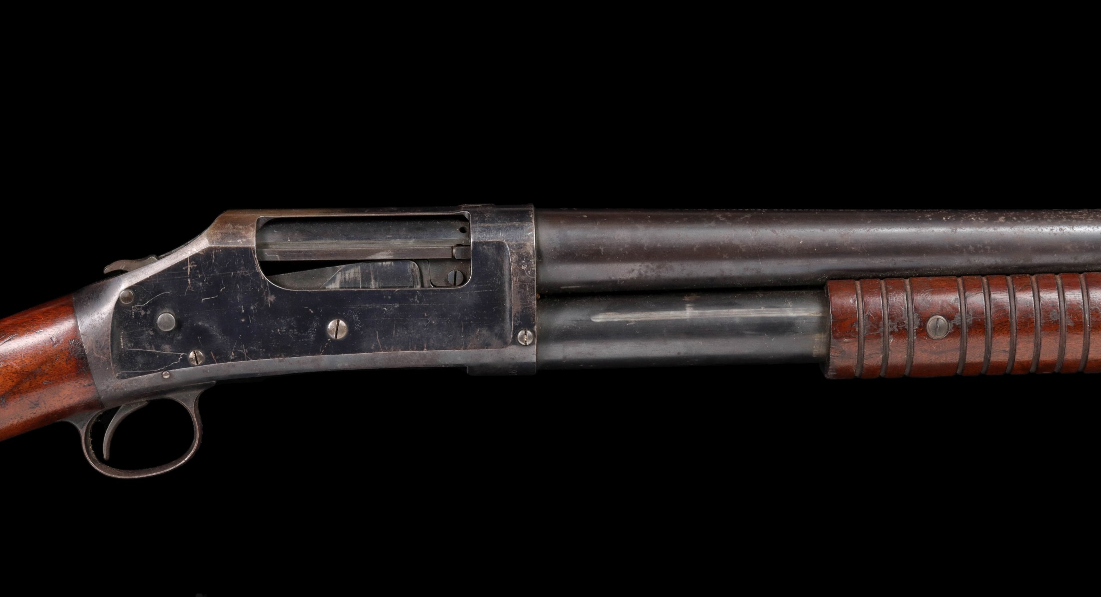 A WINCHESTER 12 GAUGE MODEL 1897 RIOT SHOTGUN