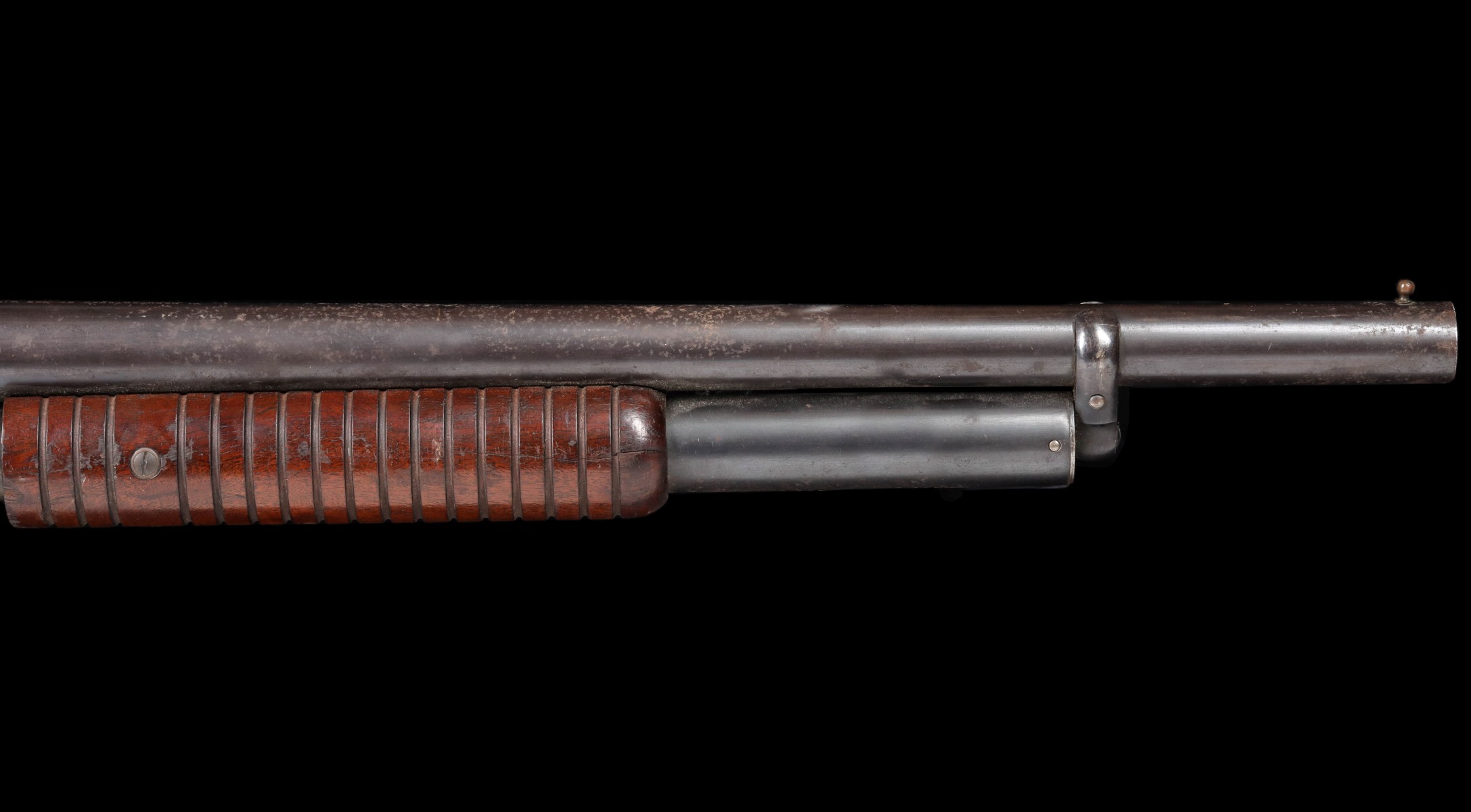 A WINCHESTER 12 GAUGE MODEL 1897 RIOT SHOTGUN
