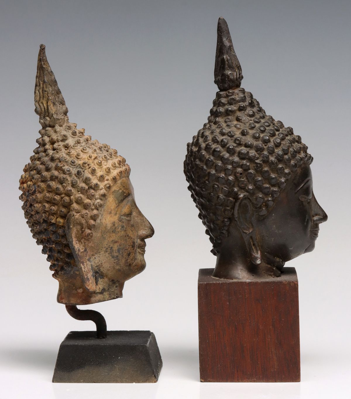 BRONZE HEAD OF BUDDHA AND TIBETAN BRASS FIGURES