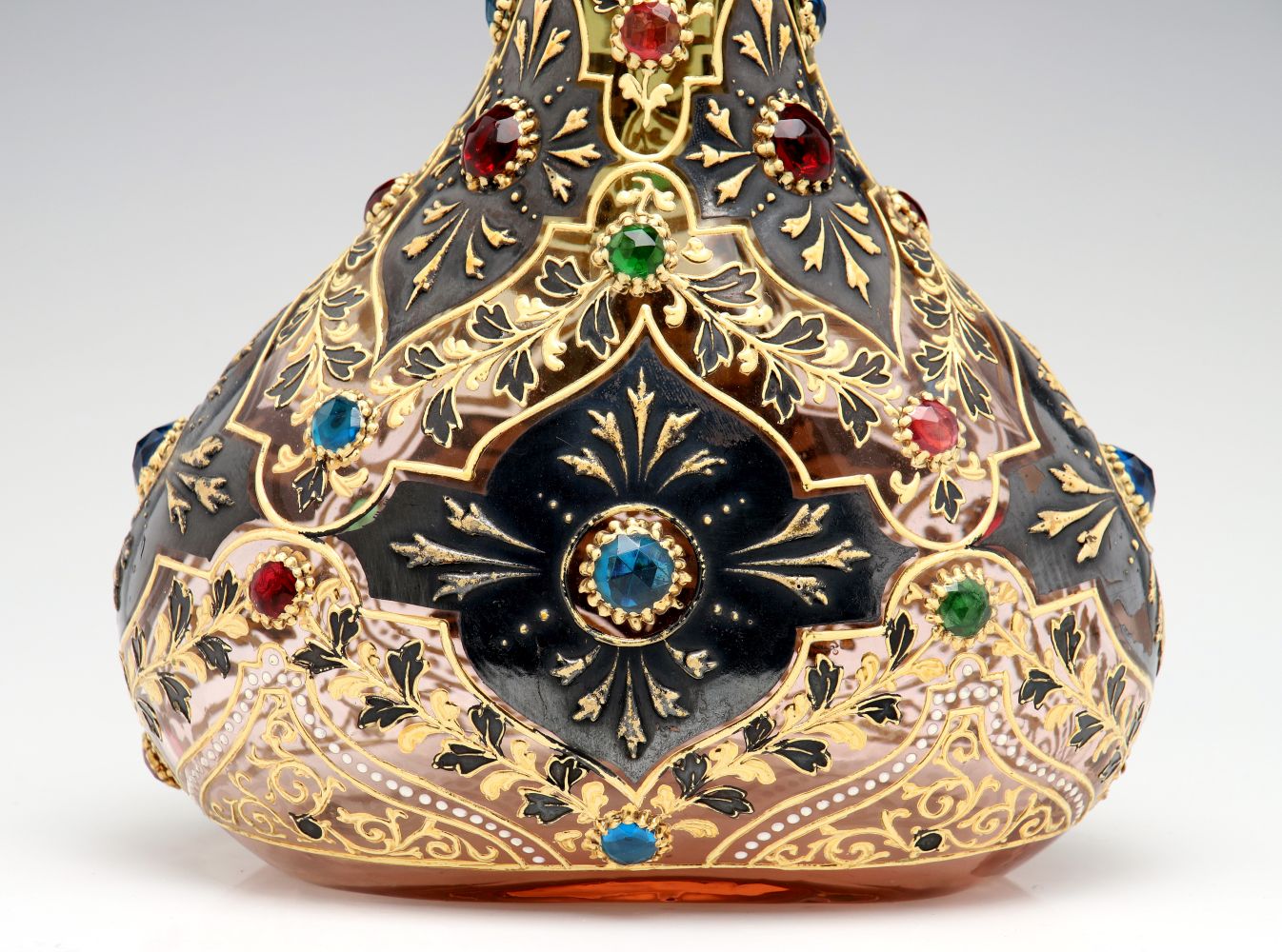 A JEWELED MOSER VASE WITH ROLLED RIM AND MUGHAL DESIGNS