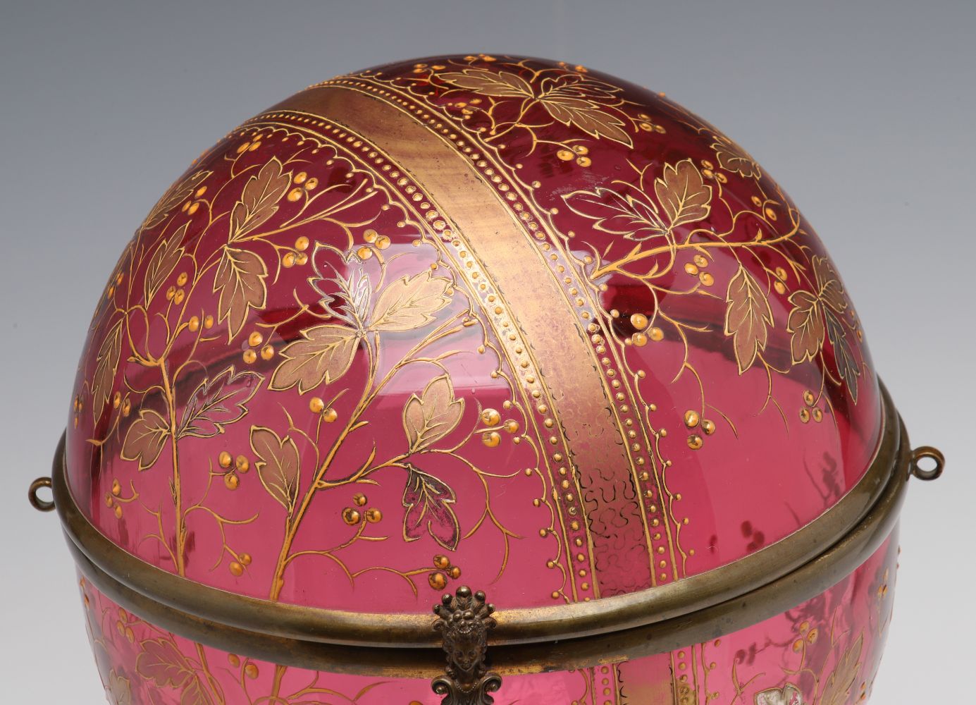 A MOSER GILT AND ENAMELED CRANBERRY GLASS TANTALUS