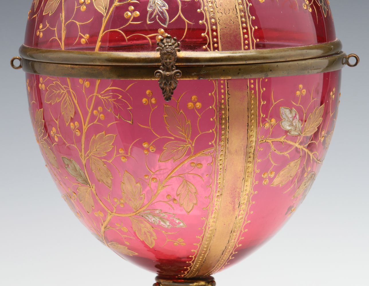 A MOSER GILT AND ENAMELED CRANBERRY GLASS TANTALUS