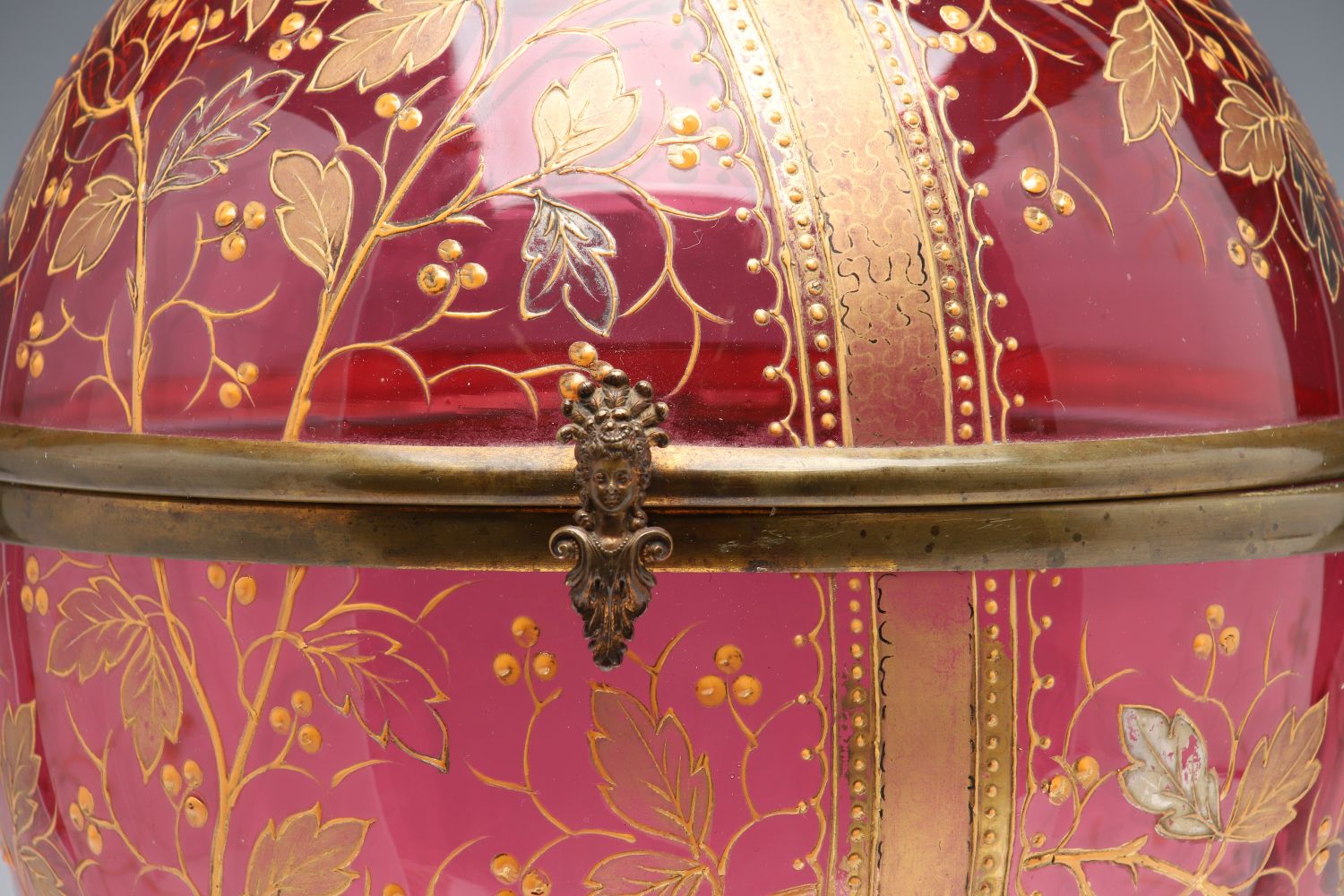 A MOSER GILT AND ENAMELED CRANBERRY GLASS TANTALUS