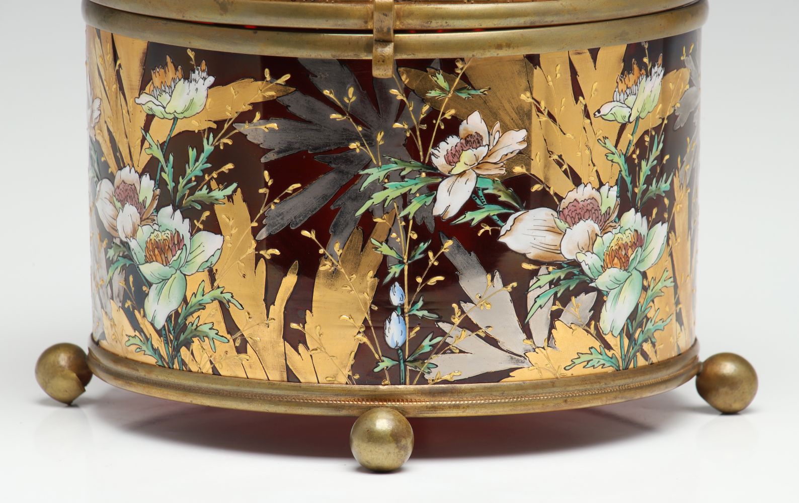 A MOSER DEEP RUBY BOX WITH GILT AND ENAMEL DECORATION