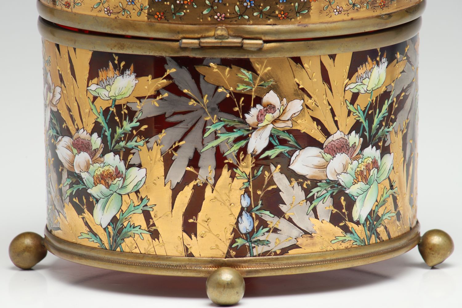 A MOSER DEEP RUBY BOX WITH GILT AND ENAMEL DECORATION