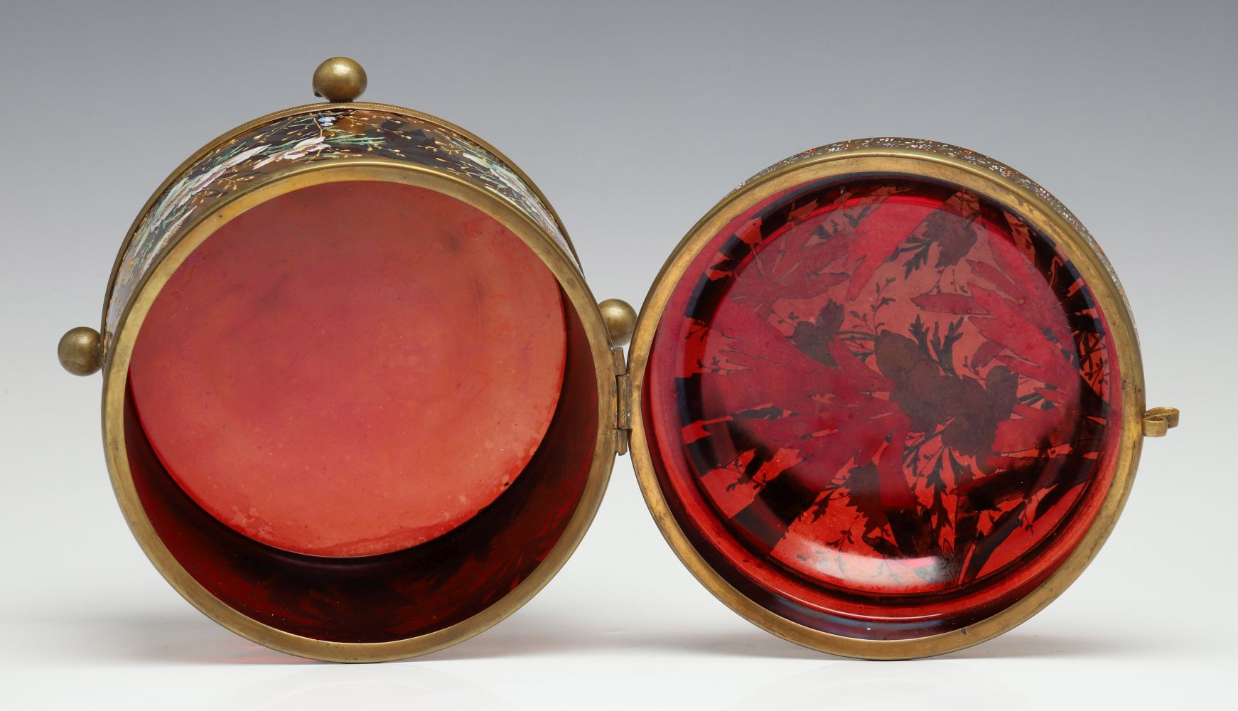 A MOSER DEEP RUBY BOX WITH GILT AND ENAMEL DECORATION