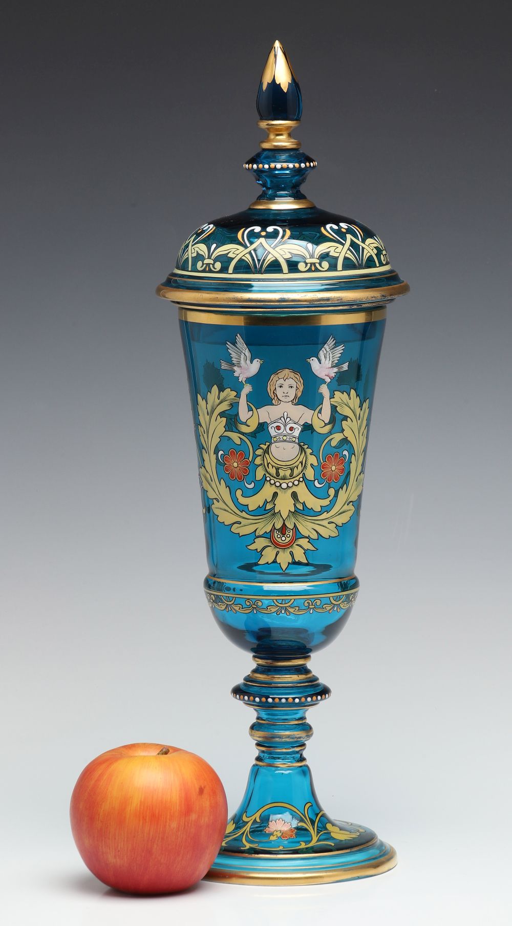 A MOSER BLUE ART GLASS DECORATED POKAL WITH COVER