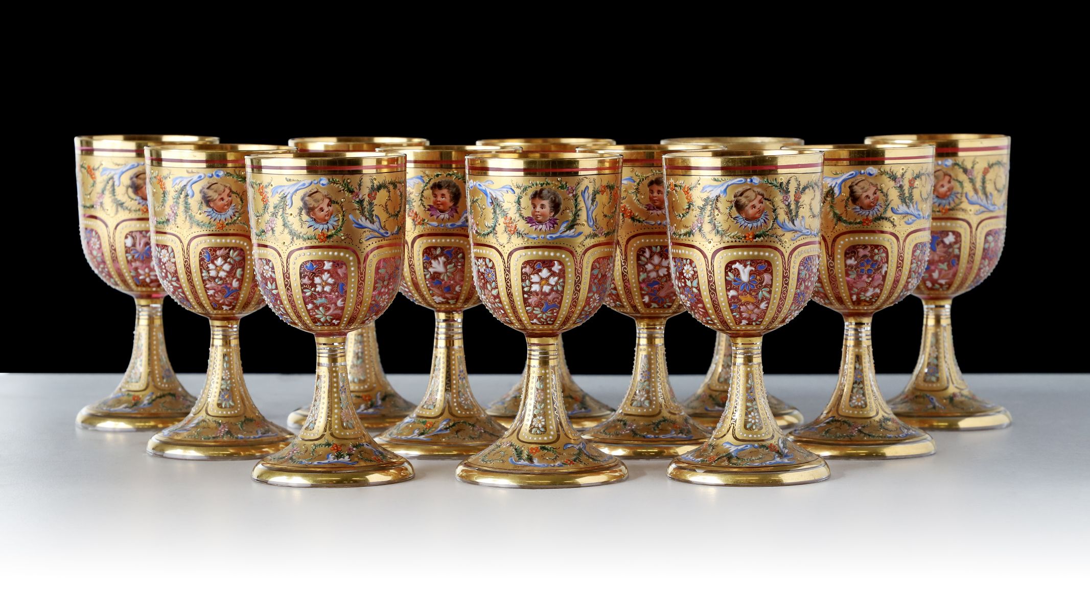 TWELVE OUTSTANDING MOSER GILT AND ENAMELED GOBLETS