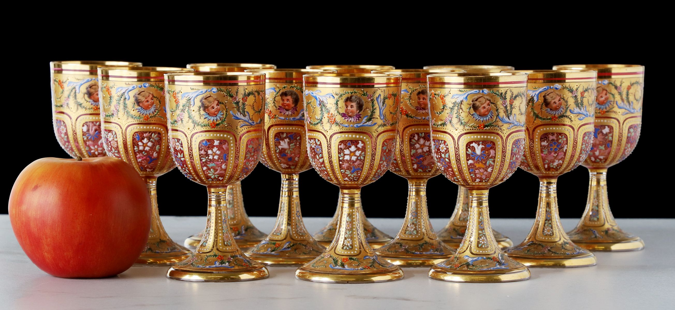 TWELVE OUTSTANDING MOSER GILT AND ENAMELED GOBLETS