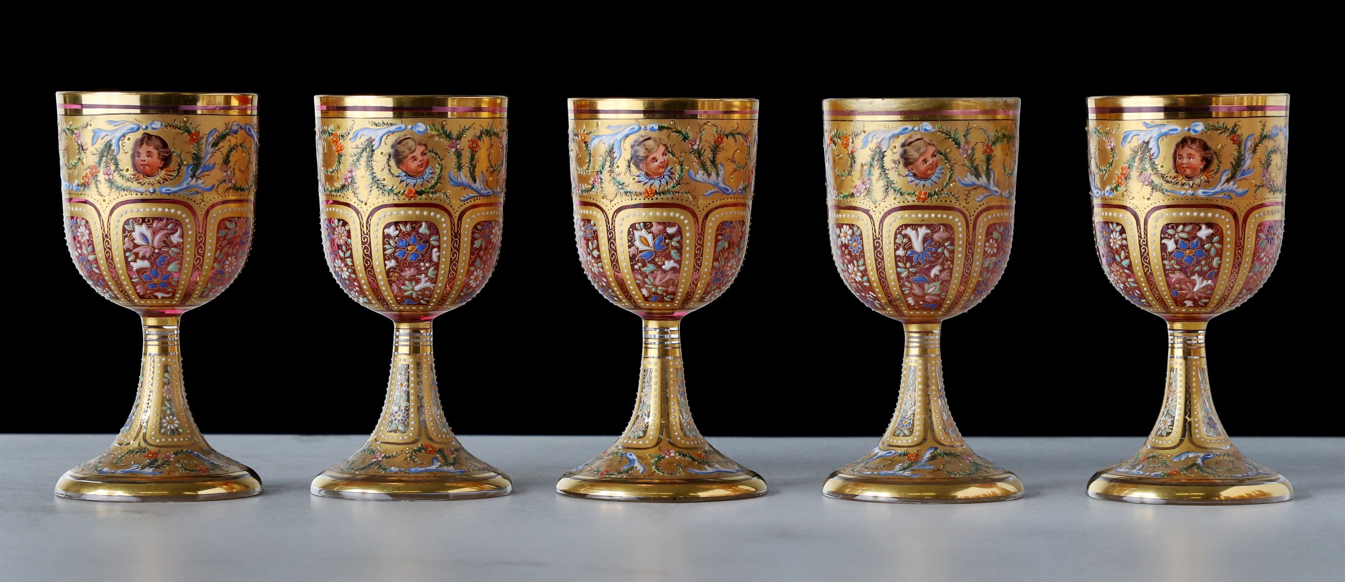 TWELVE OUTSTANDING MOSER GILT AND ENAMELED GOBLETS