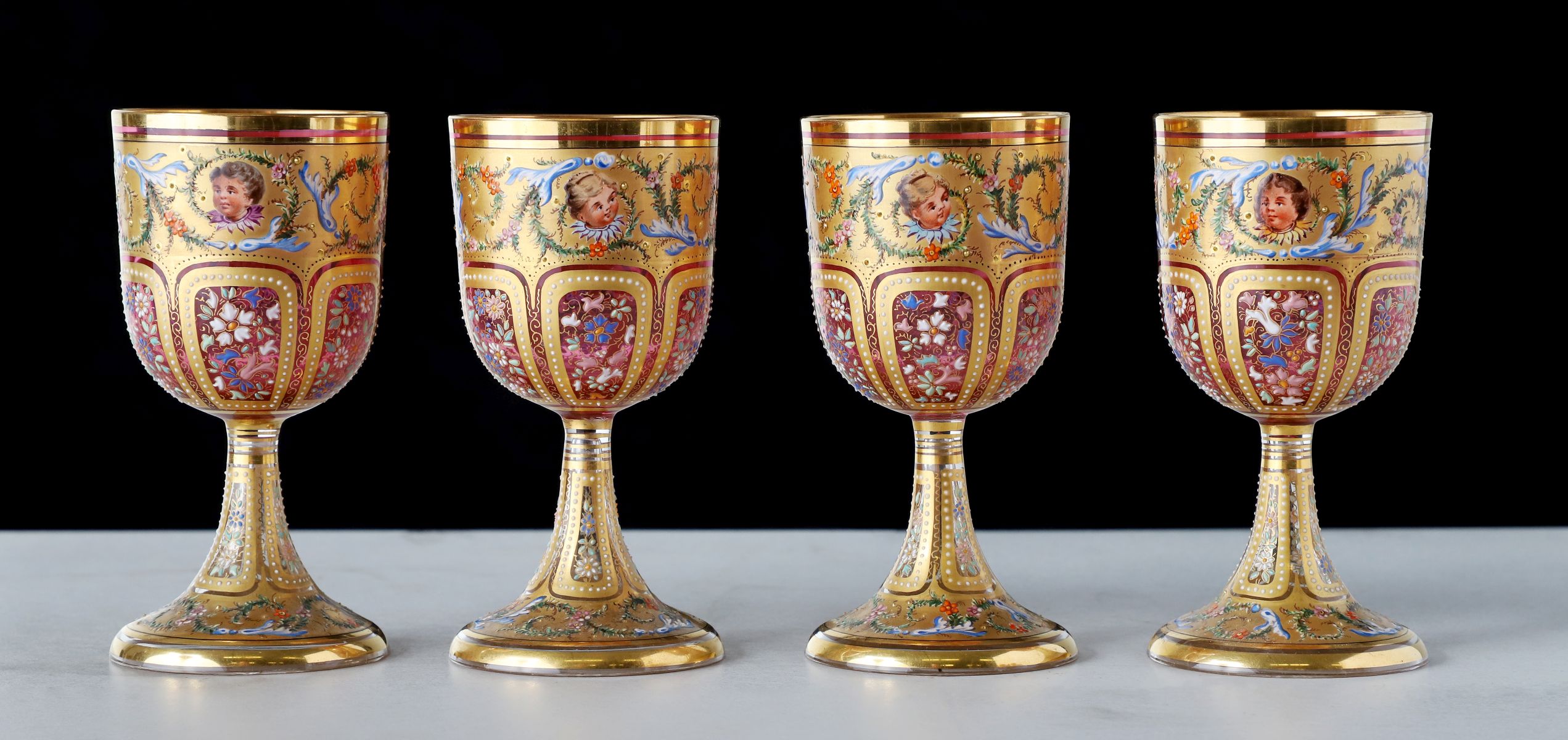 TWELVE OUTSTANDING MOSER GILT AND ENAMELED GOBLETS