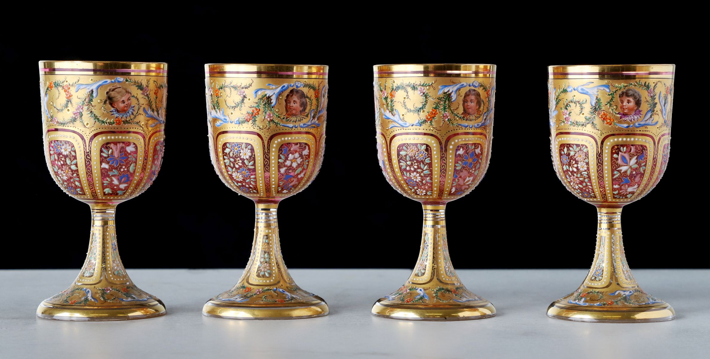 TWELVE OUTSTANDING MOSER GILT AND ENAMELED GOBLETS