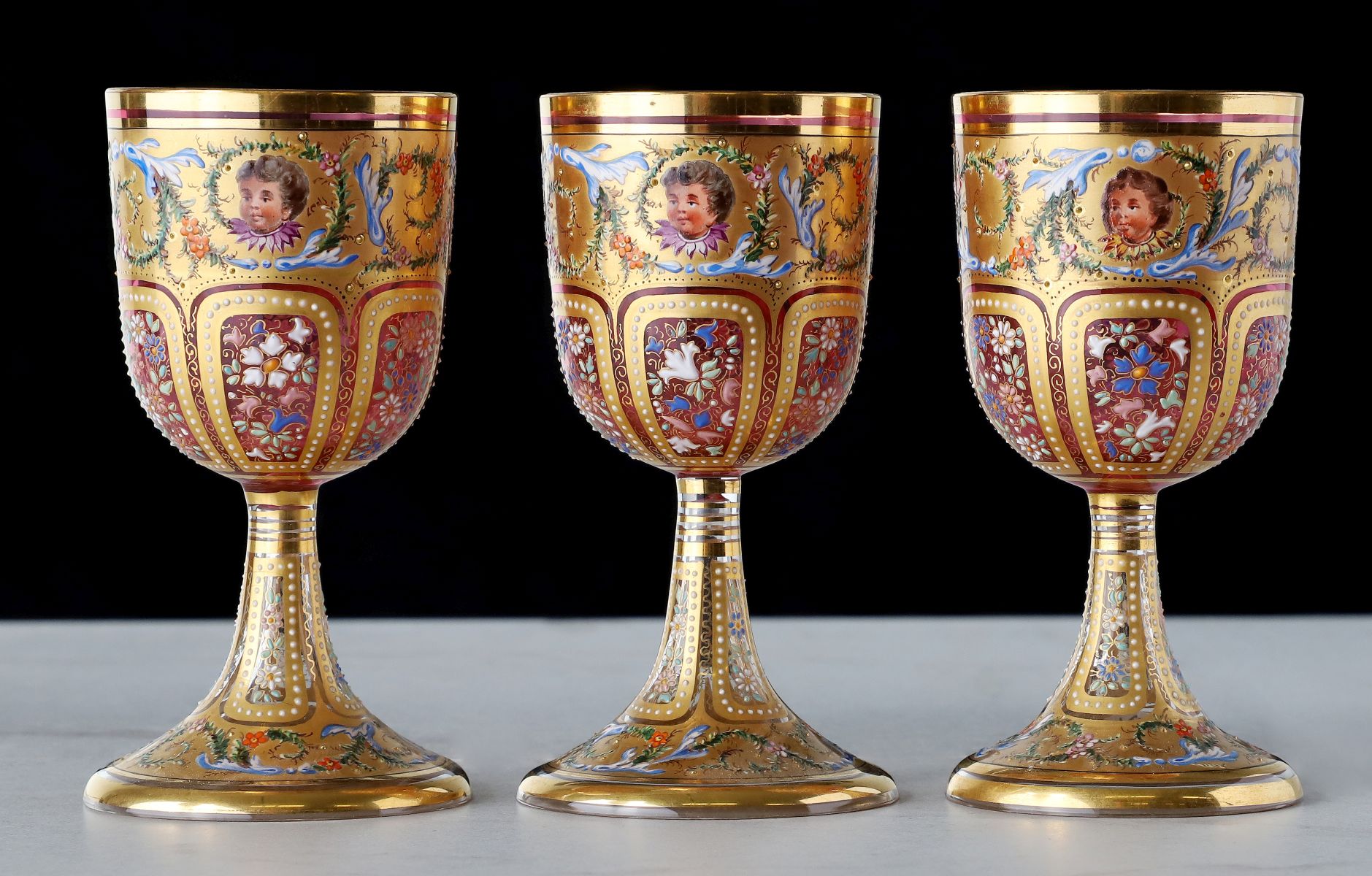 TWELVE OUTSTANDING MOSER GILT AND ENAMELED GOBLETS