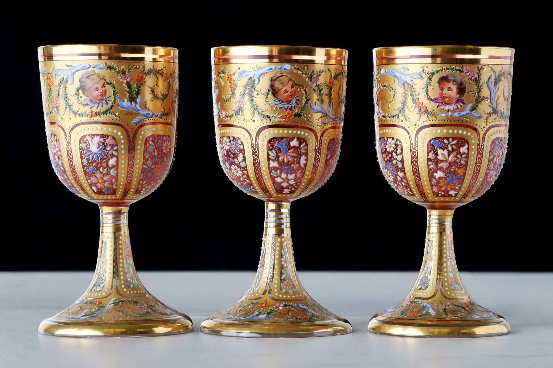 TWELVE OUTSTANDING MOSER GILT AND ENAMELED GOBLETS