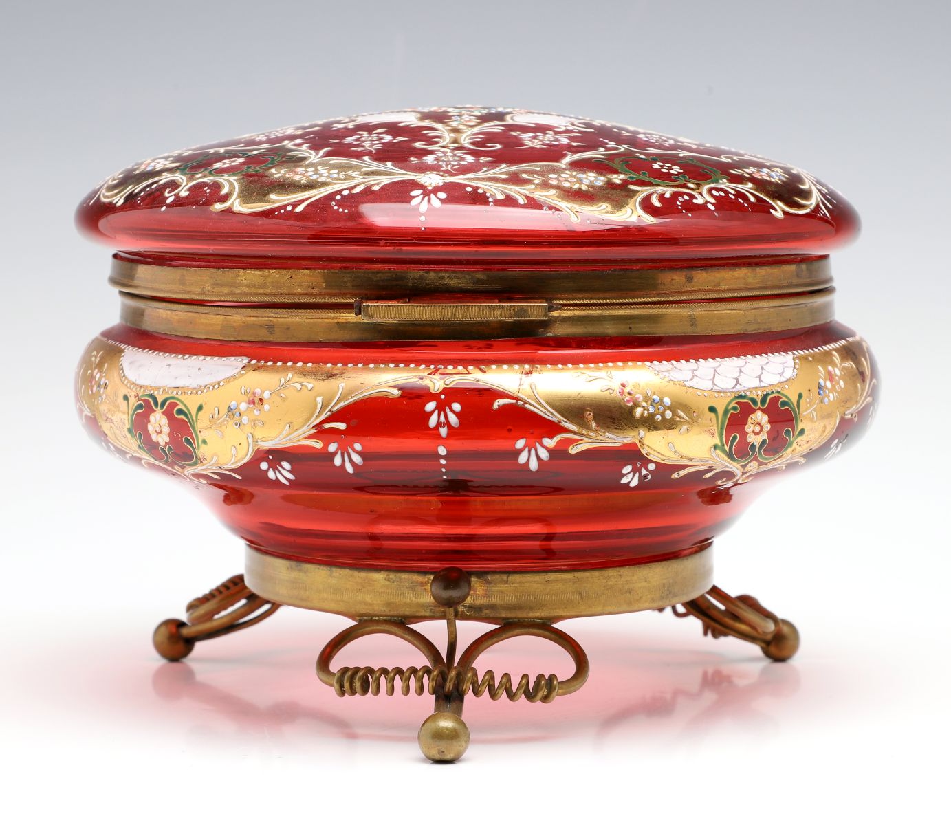 A MOSER GILT AND ENAMEL DECORATED CRANBERRY GLASS BOX