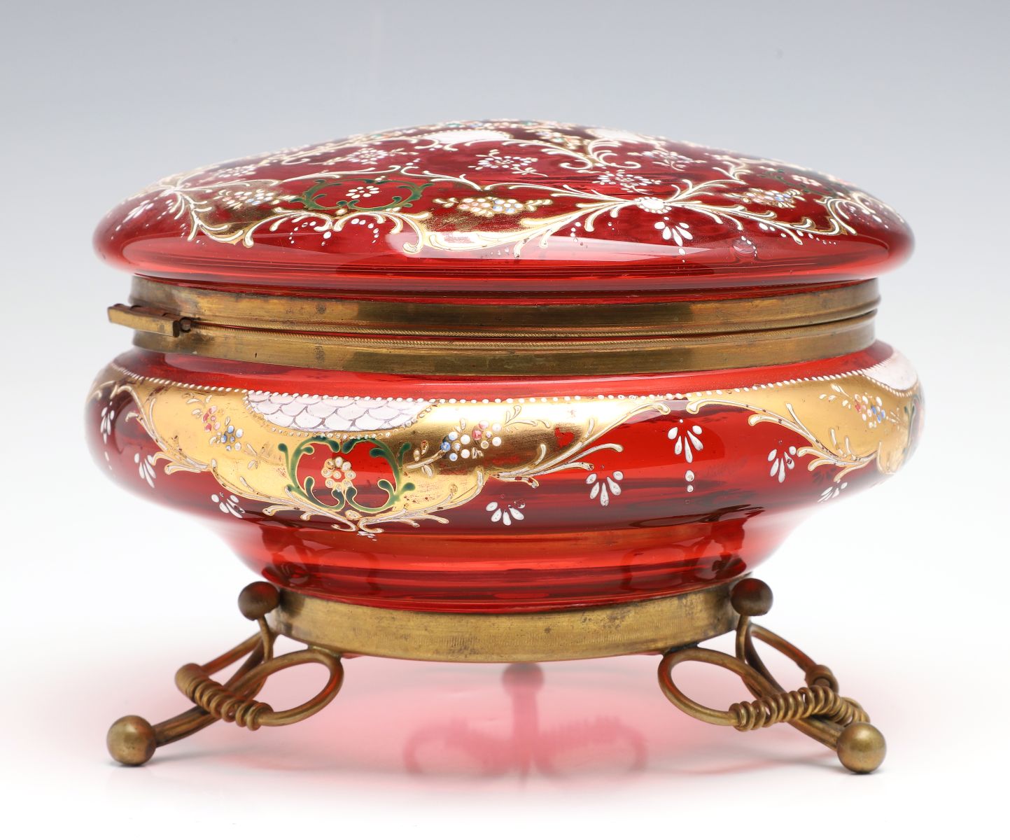 A MOSER GILT AND ENAMEL DECORATED CRANBERRY GLASS BOX