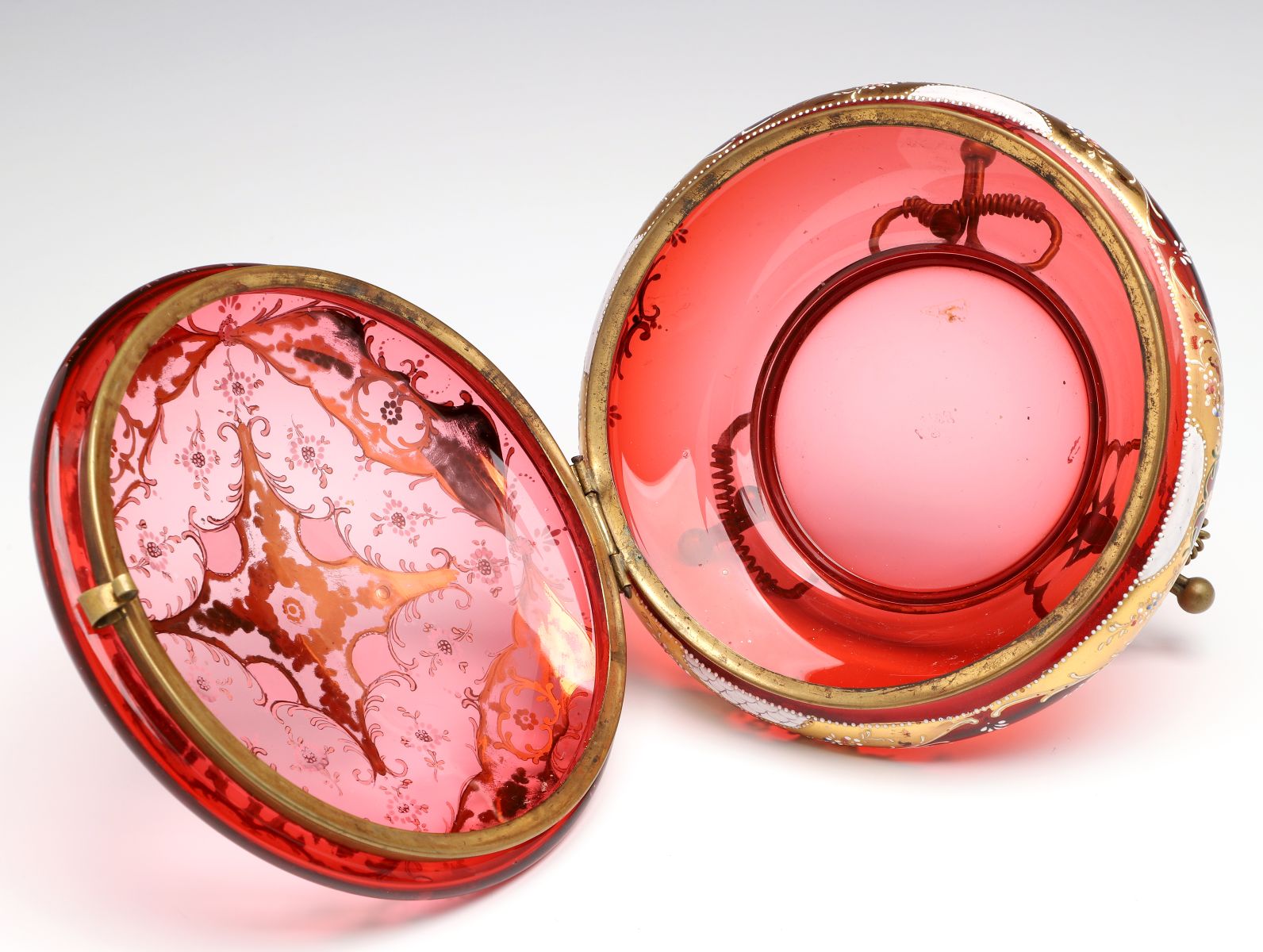 A MOSER GILT AND ENAMEL DECORATED CRANBERRY GLASS BOX