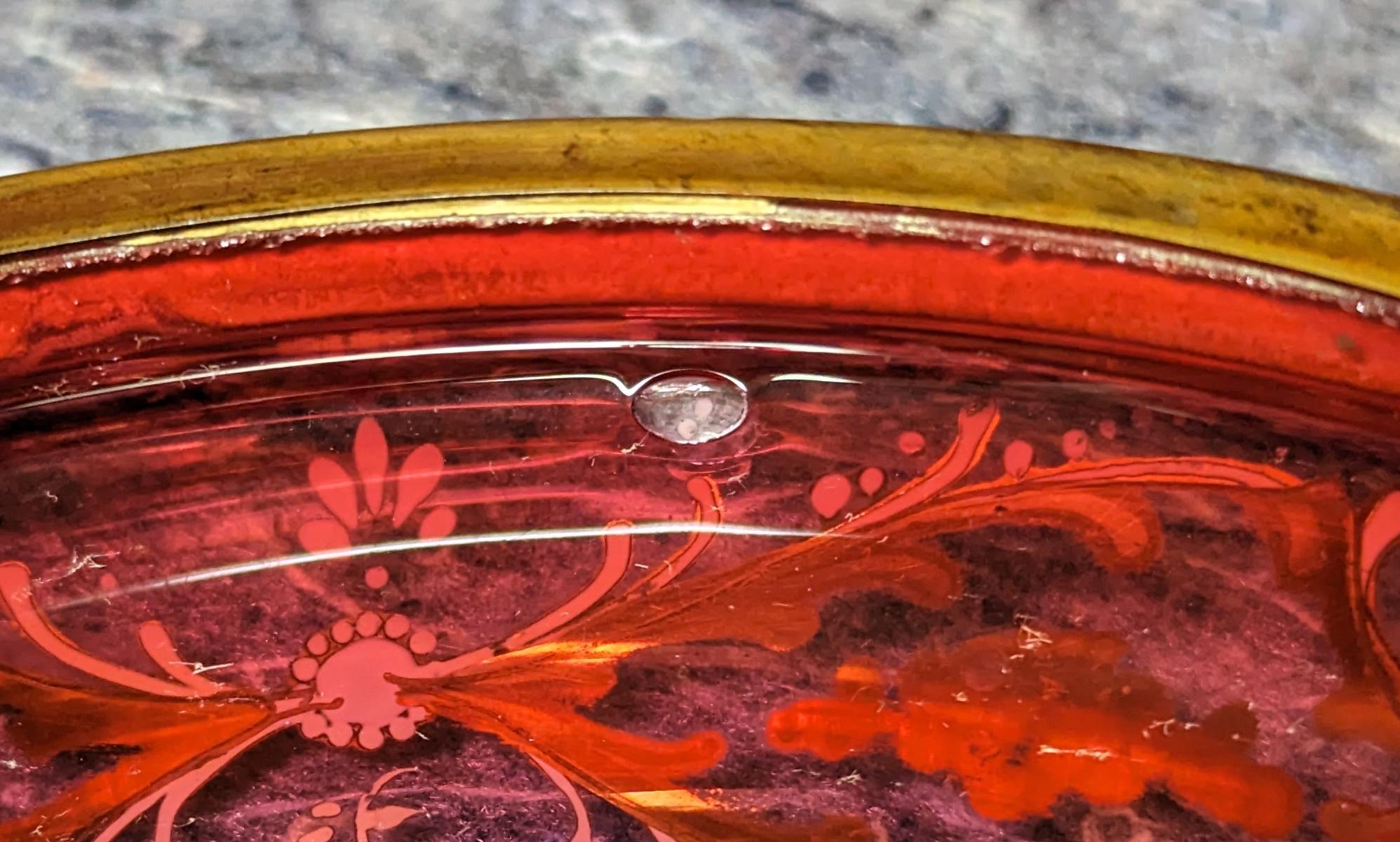 A MOSER GILT AND ENAMEL DECORATED CRANBERRY GLASS BOX