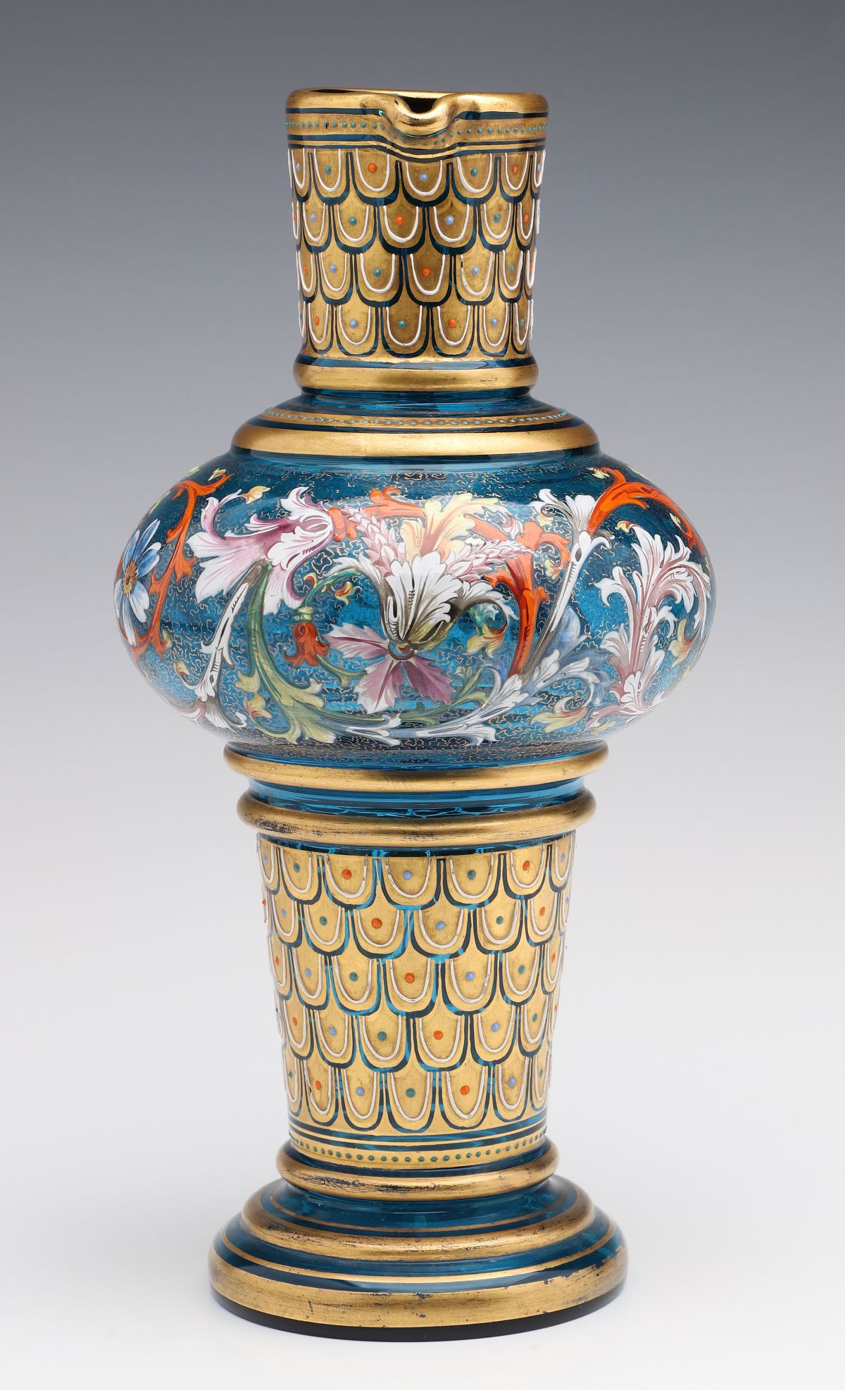 A MOSER BLUE GLASS JUG WITH GILT AND ENAMEL DECORATION