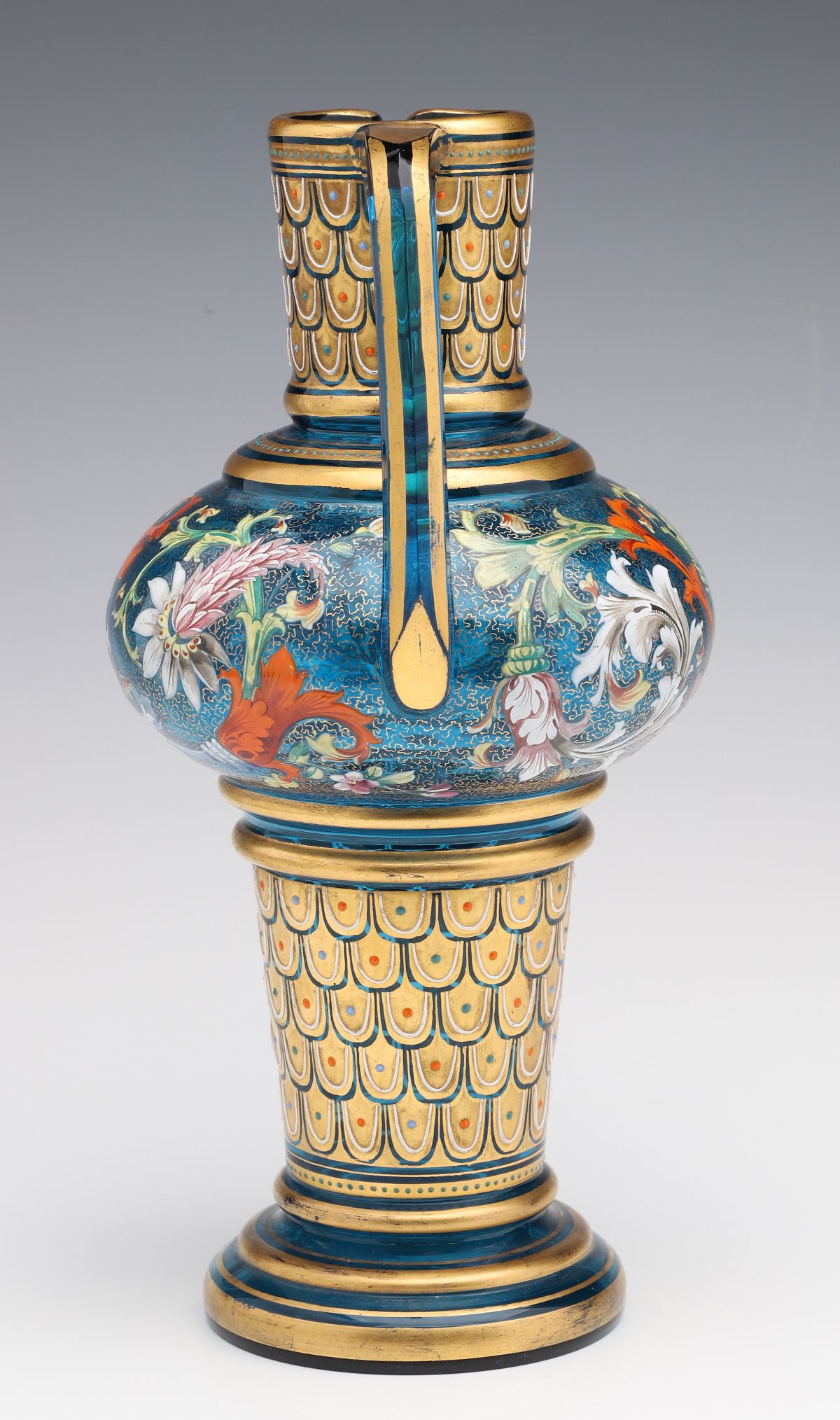 A MOSER BLUE GLASS JUG WITH GILT AND ENAMEL DECORATION