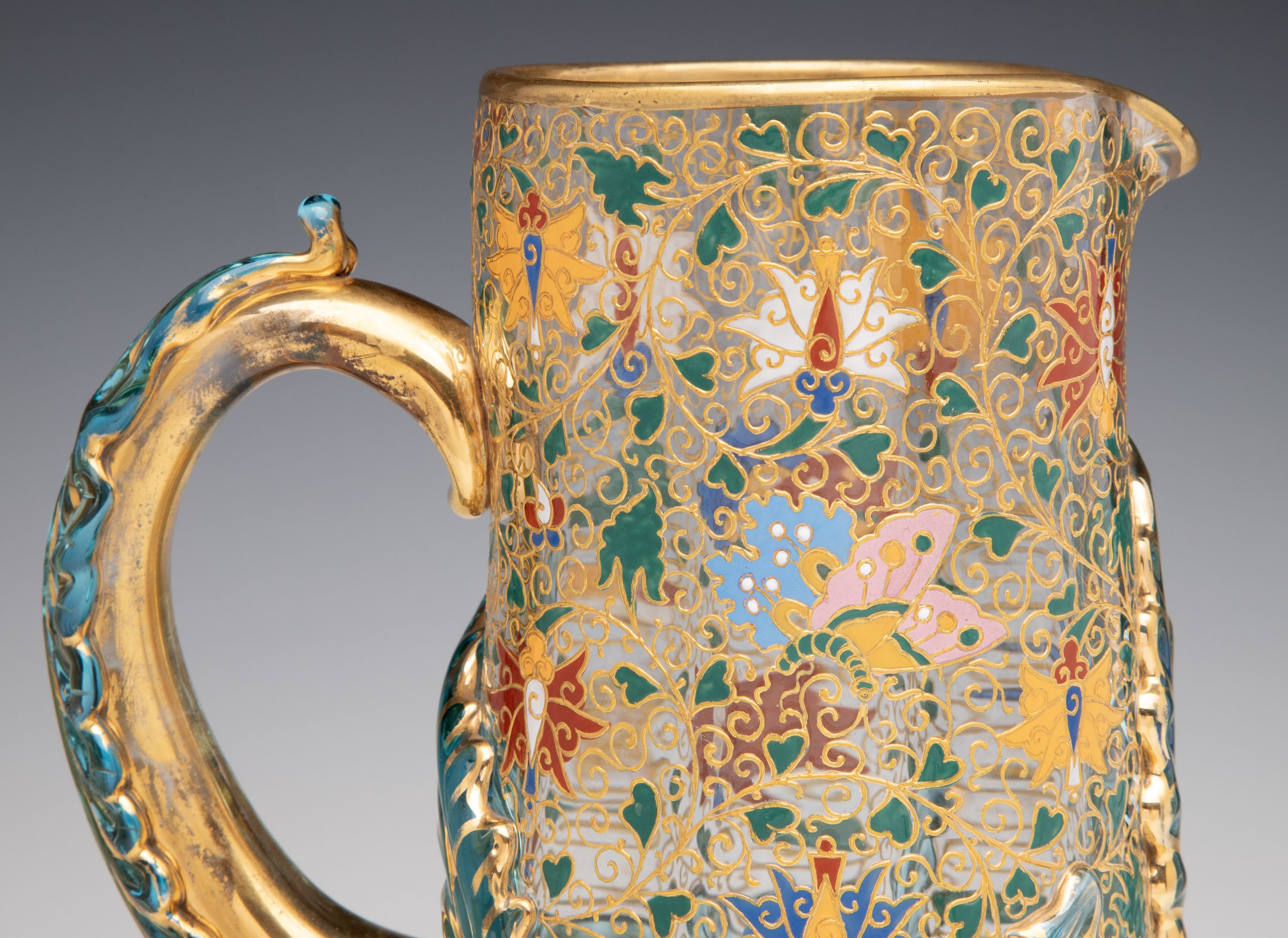 UNUSUAL GILT AND ENAMEL MOSER JUG WITH APPLIED LEAVES