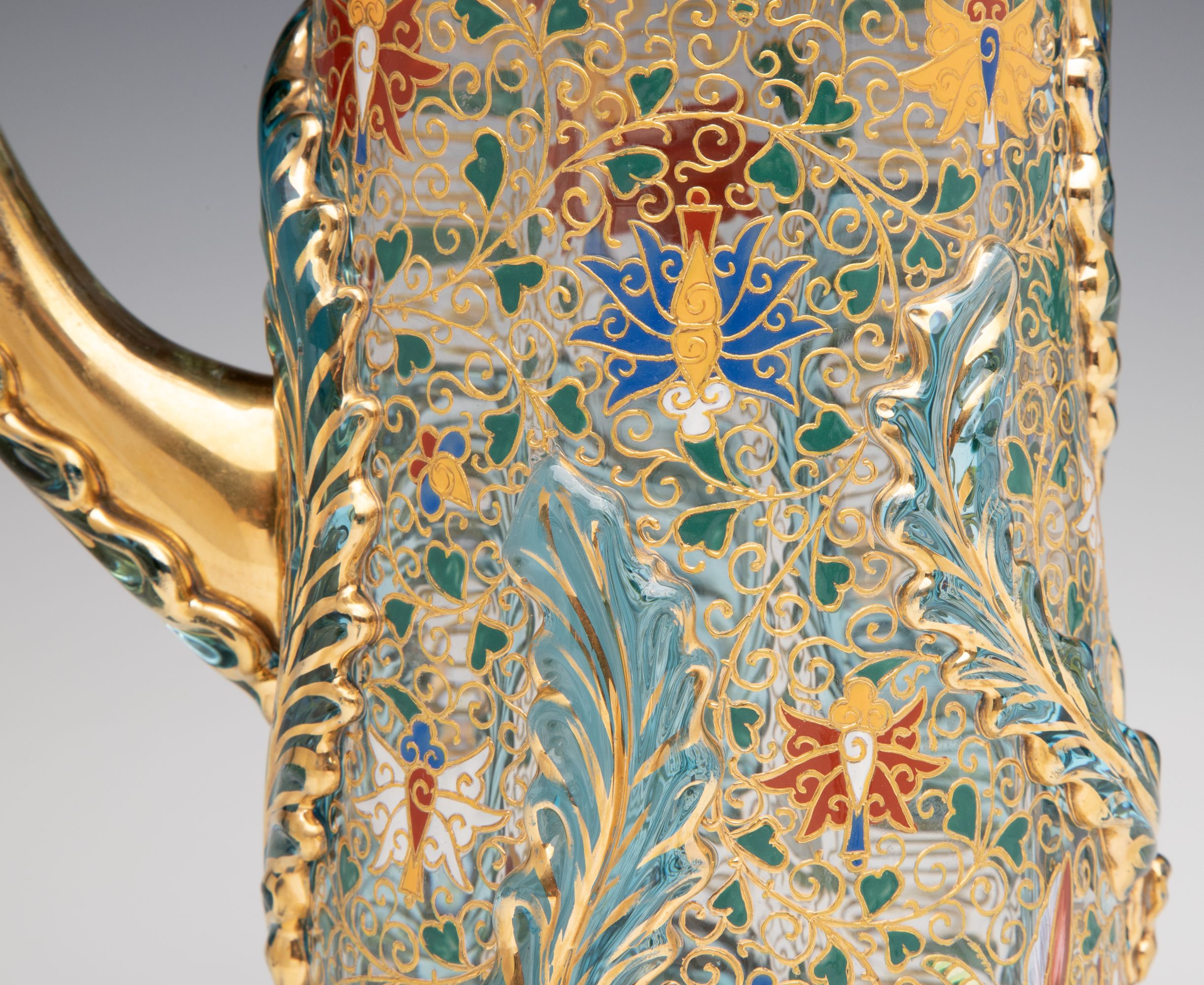 UNUSUAL GILT AND ENAMEL MOSER JUG WITH APPLIED LEAVES